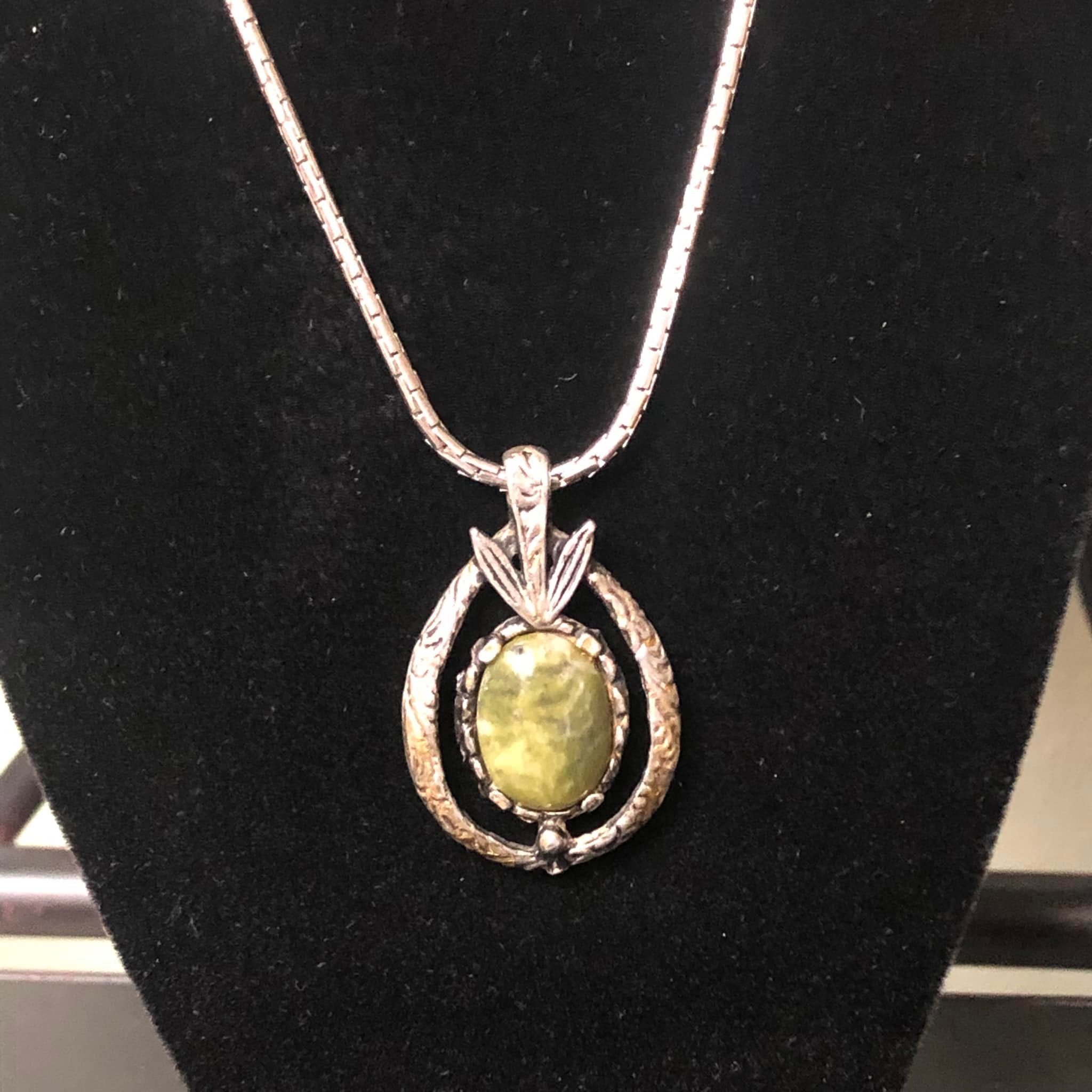 What is the origin of this unknown necklace tag?