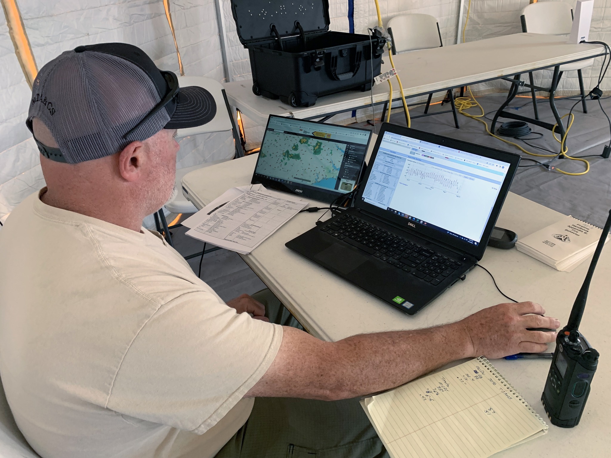 N.C. - Fire Behavior Analyst Keith Money checks the radar to track ...