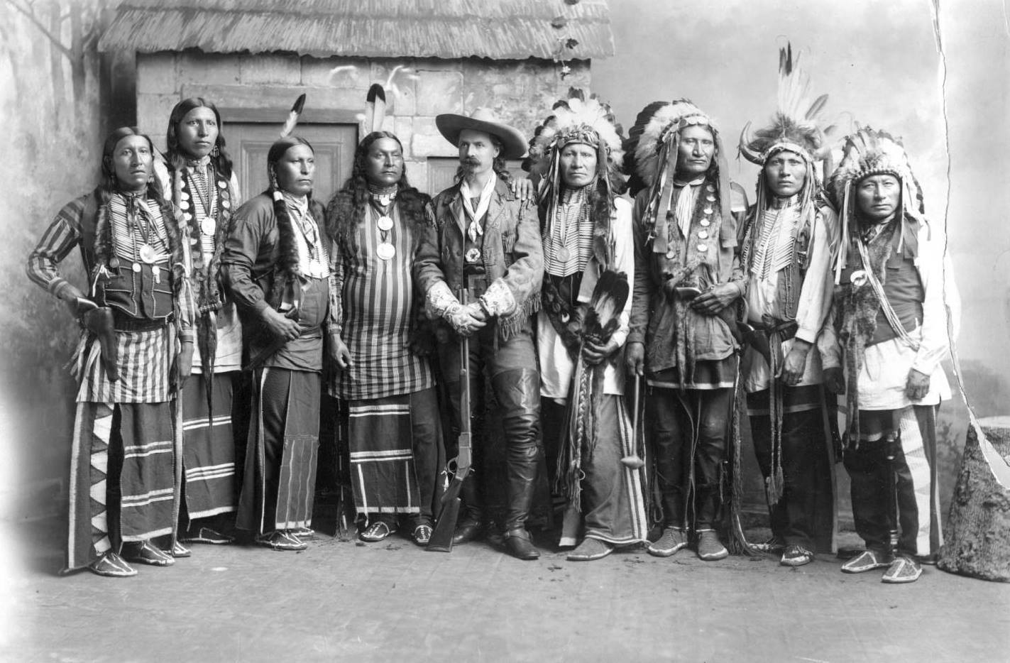 William Frederick Buffalo Bill Cody stands in the left center of a 