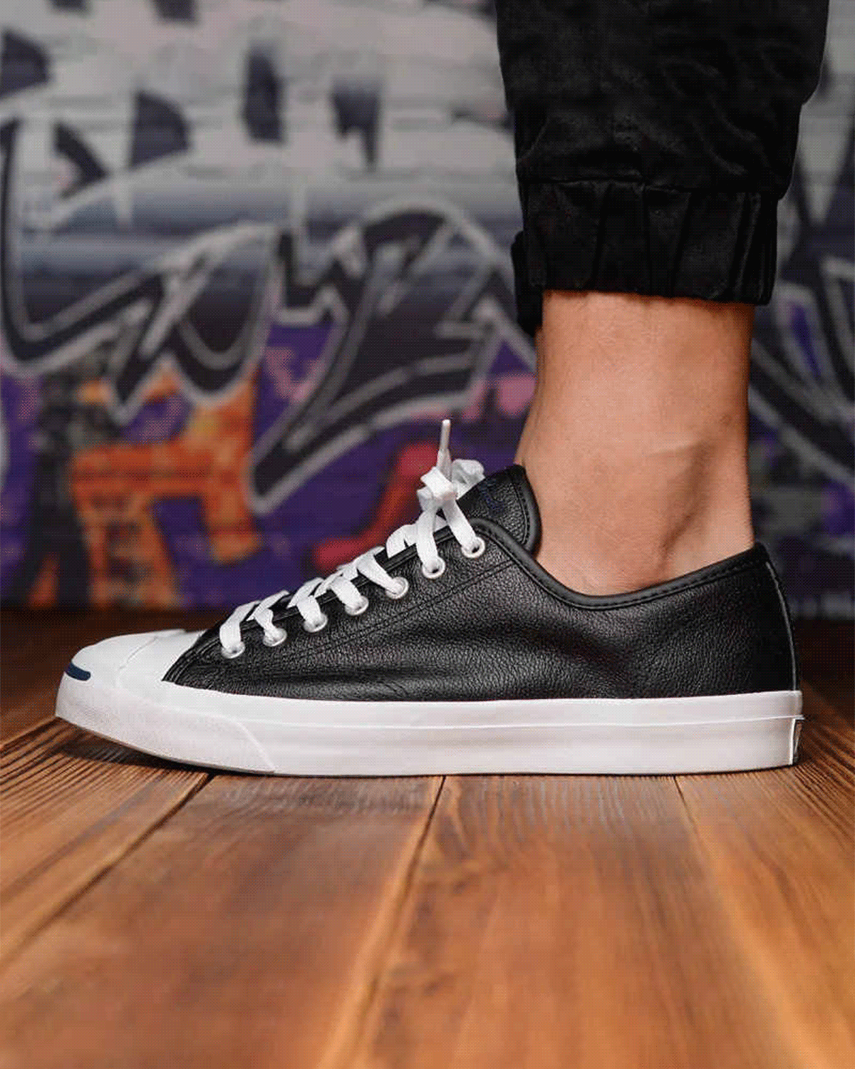 Converse Jack Purcell x Denham sneaker's classic leather upper is