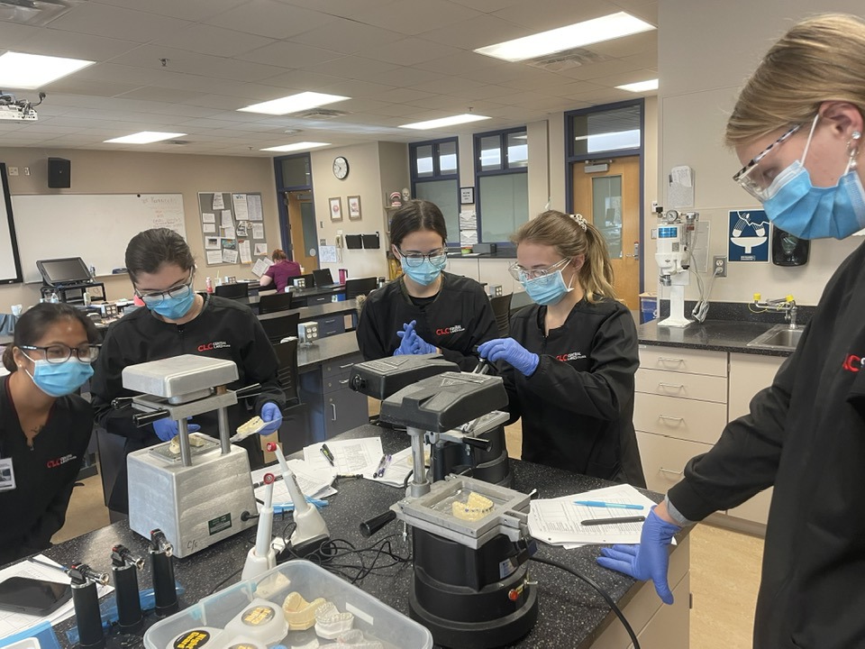Busy day in lab practicing... - CLC Dental Assisting Program