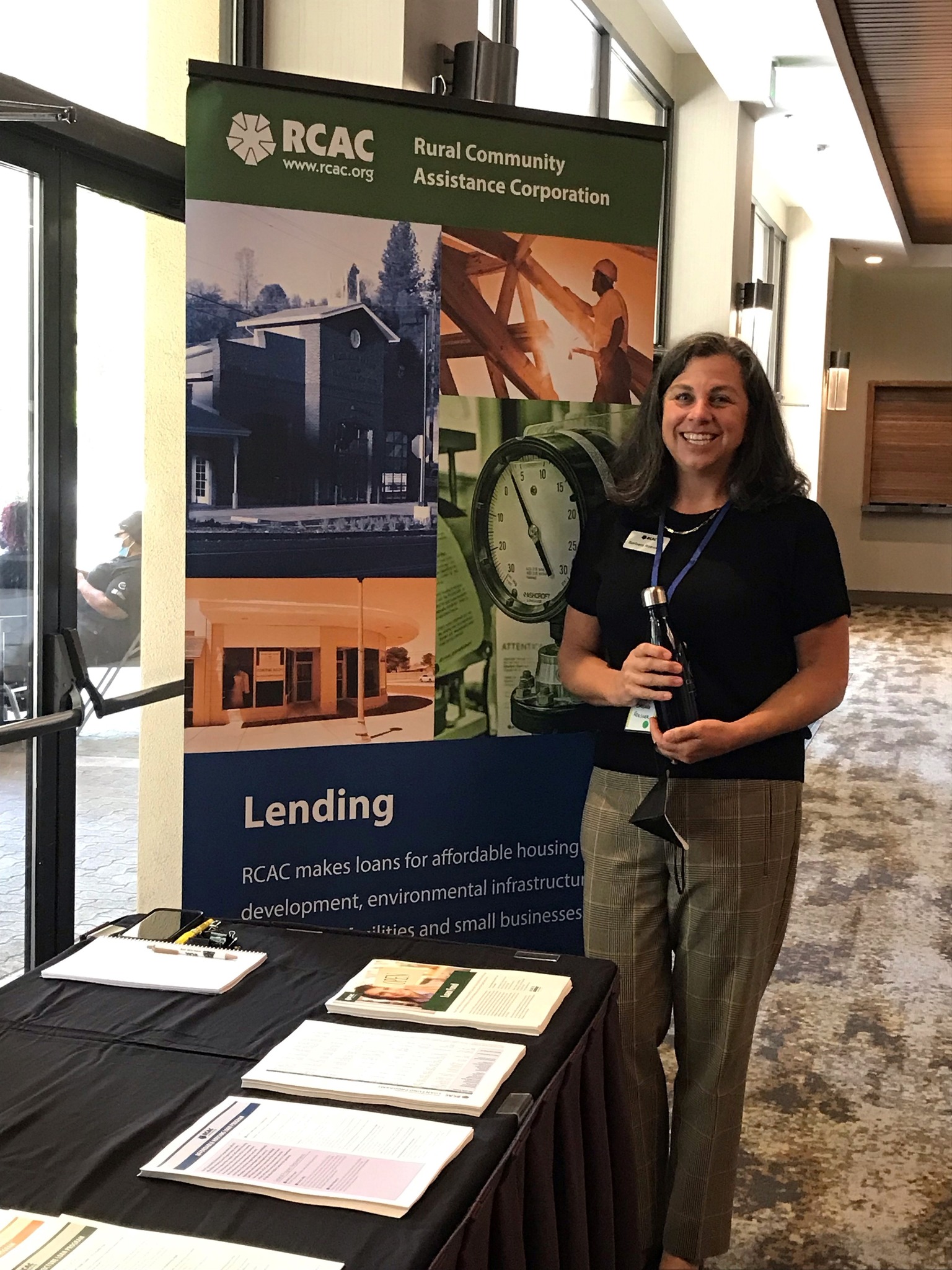 RCAC - An RCAC employee standing at an RCAC booth at the Affordable ...