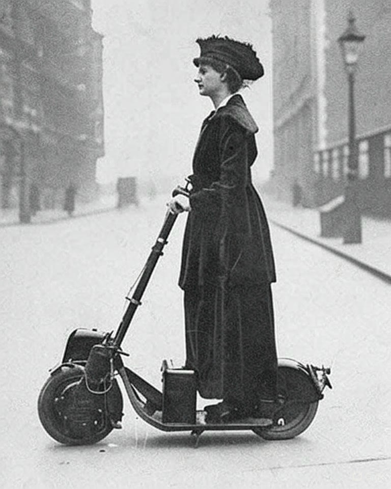 Historical - Woman Riding a Very Early Scooter, 1916 In the annals of ...