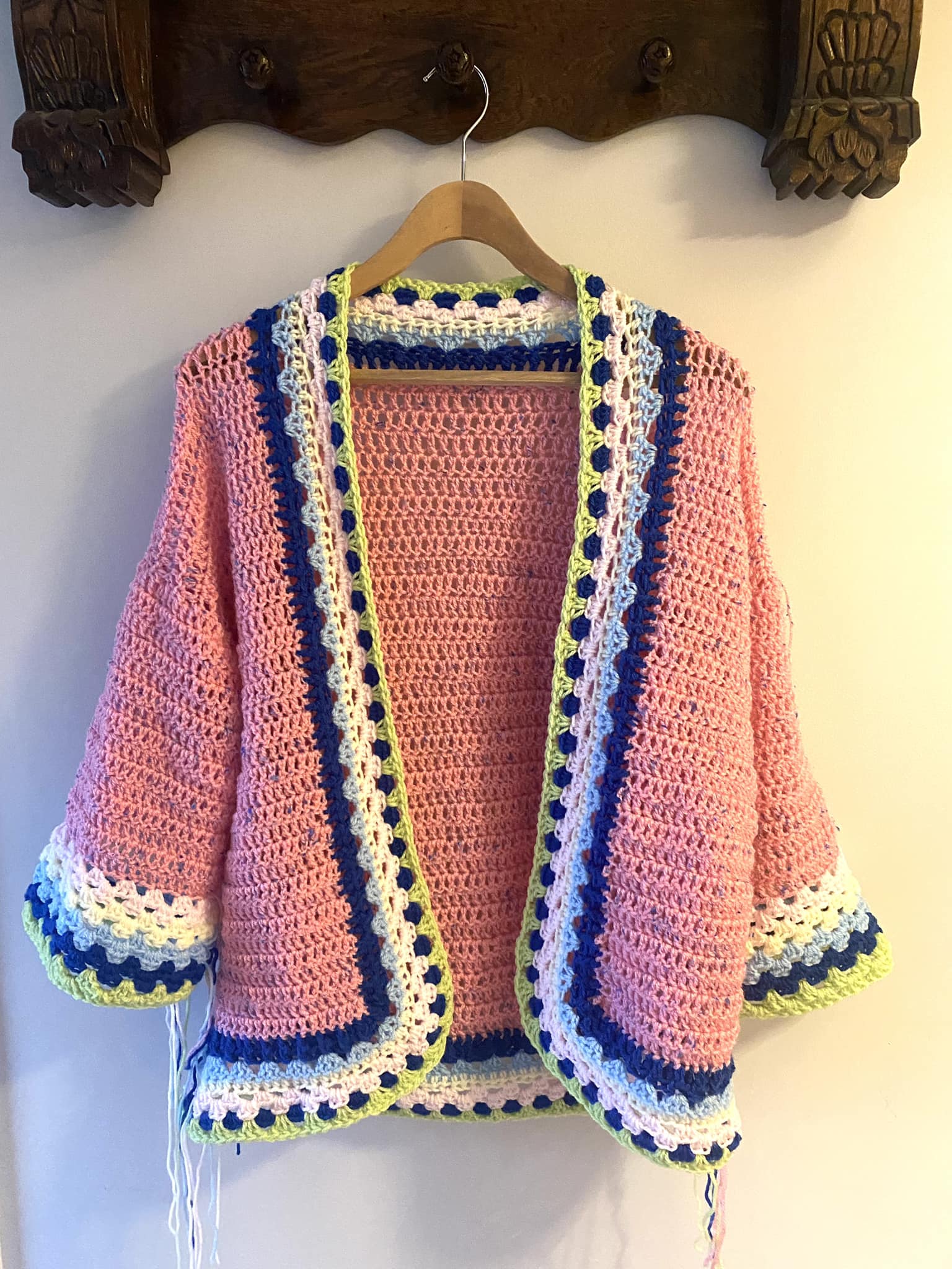 One-piece cardigan construction for sleeves