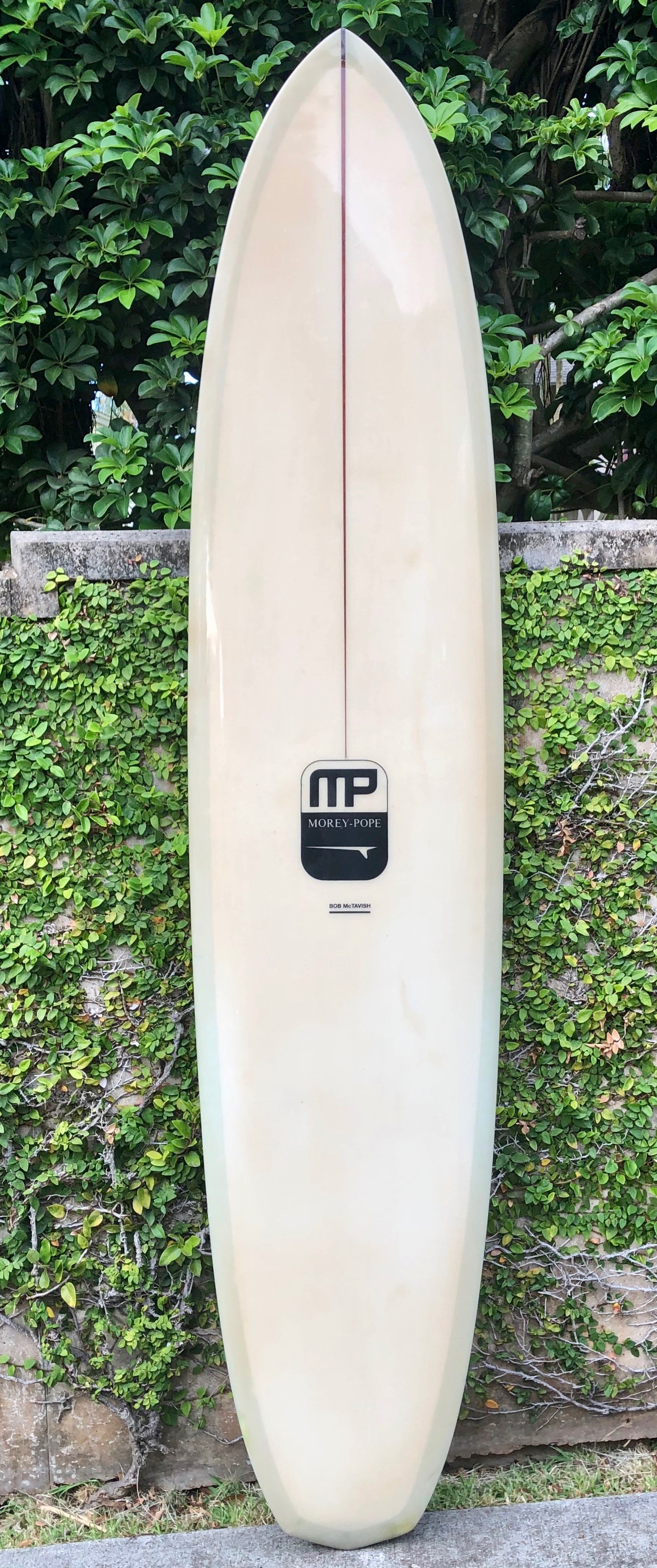 Riding a McTavish pre-tracker surfboard