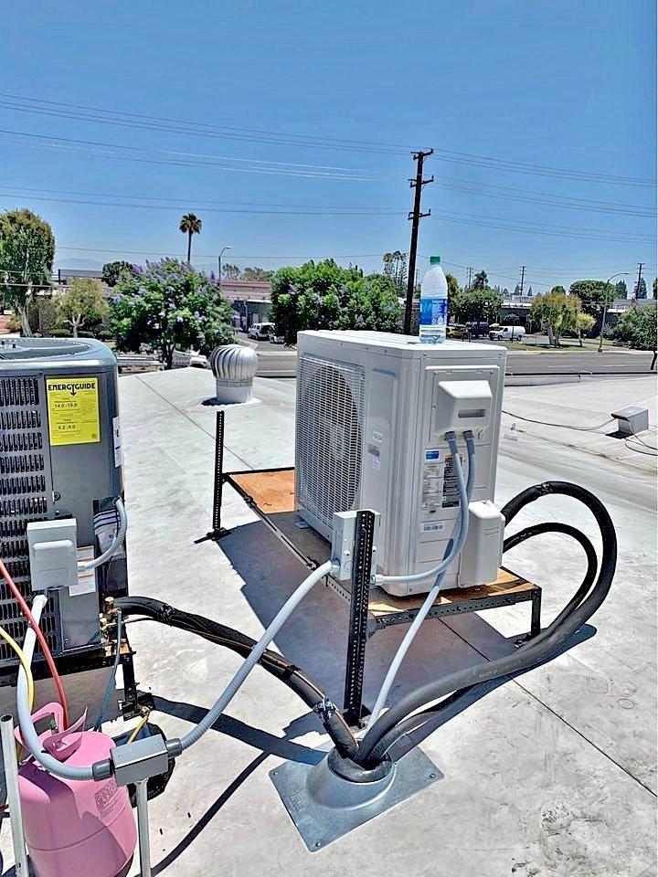 HVAC INFO - a rooftop HVAC setup featuring a mini-split...