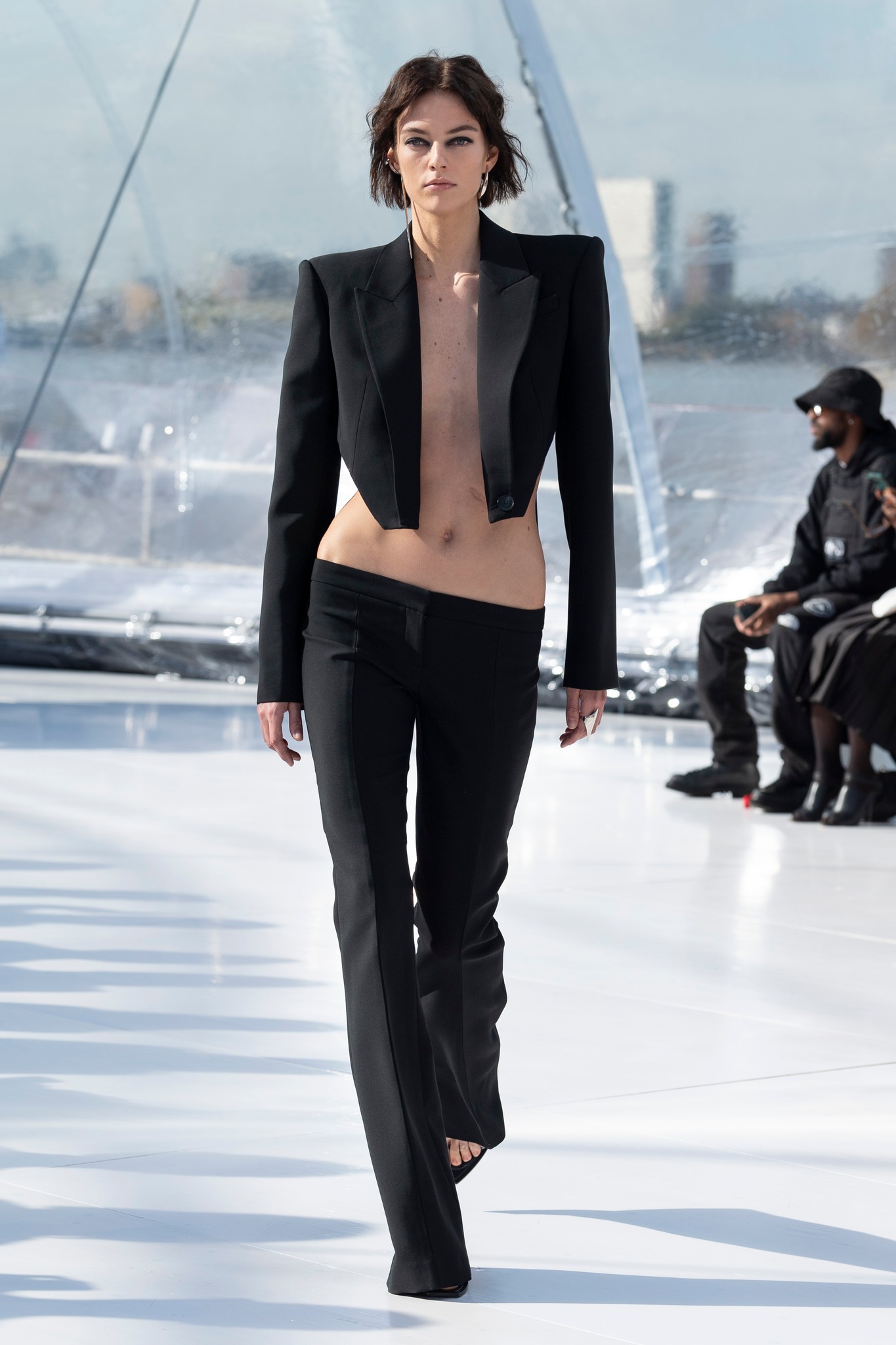 Alexander - A sliced tailored jacket and bumster trousers in black 