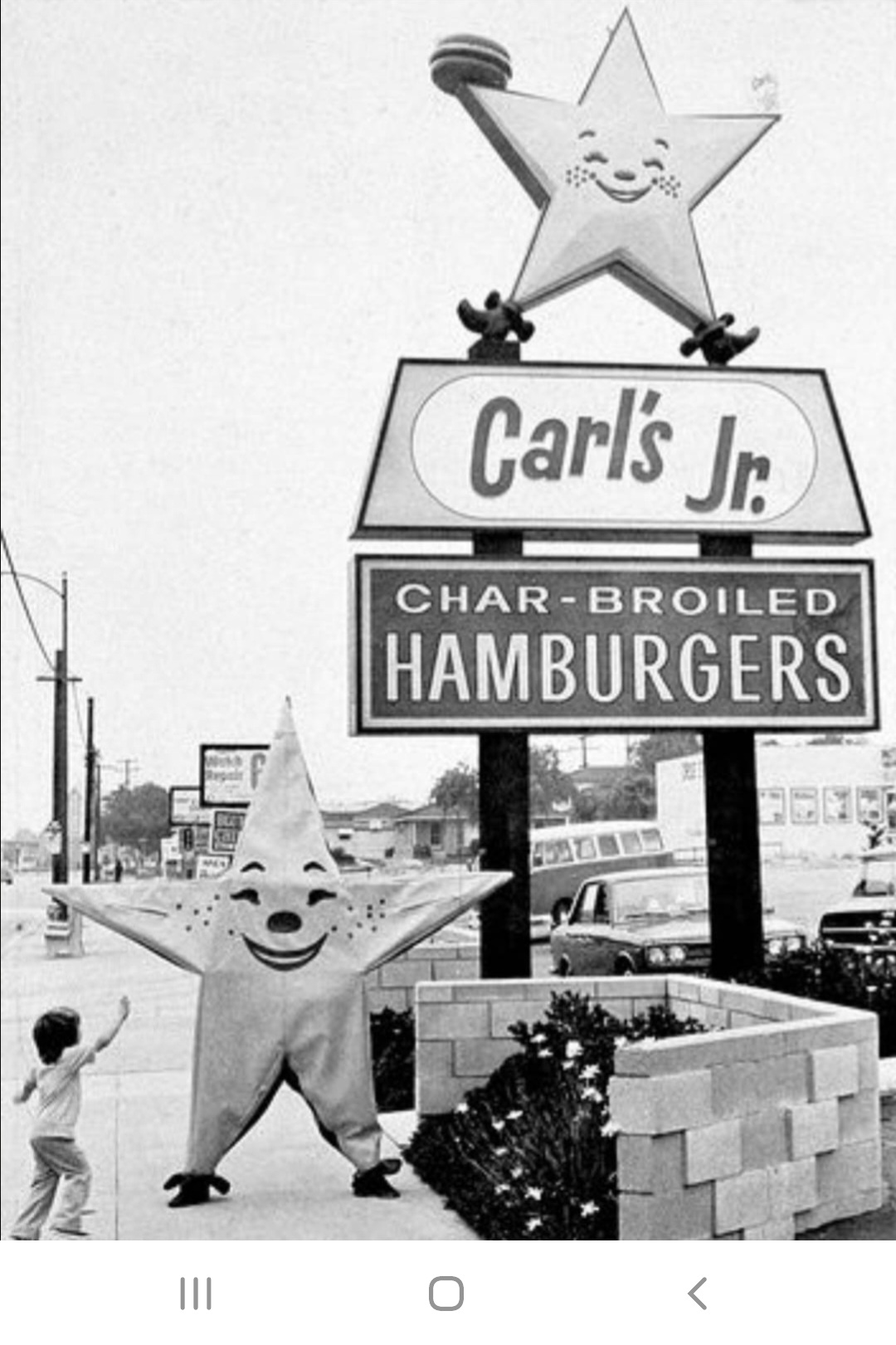 Carl's Jr and the star mascot. This may be the 70's but i wouldn't