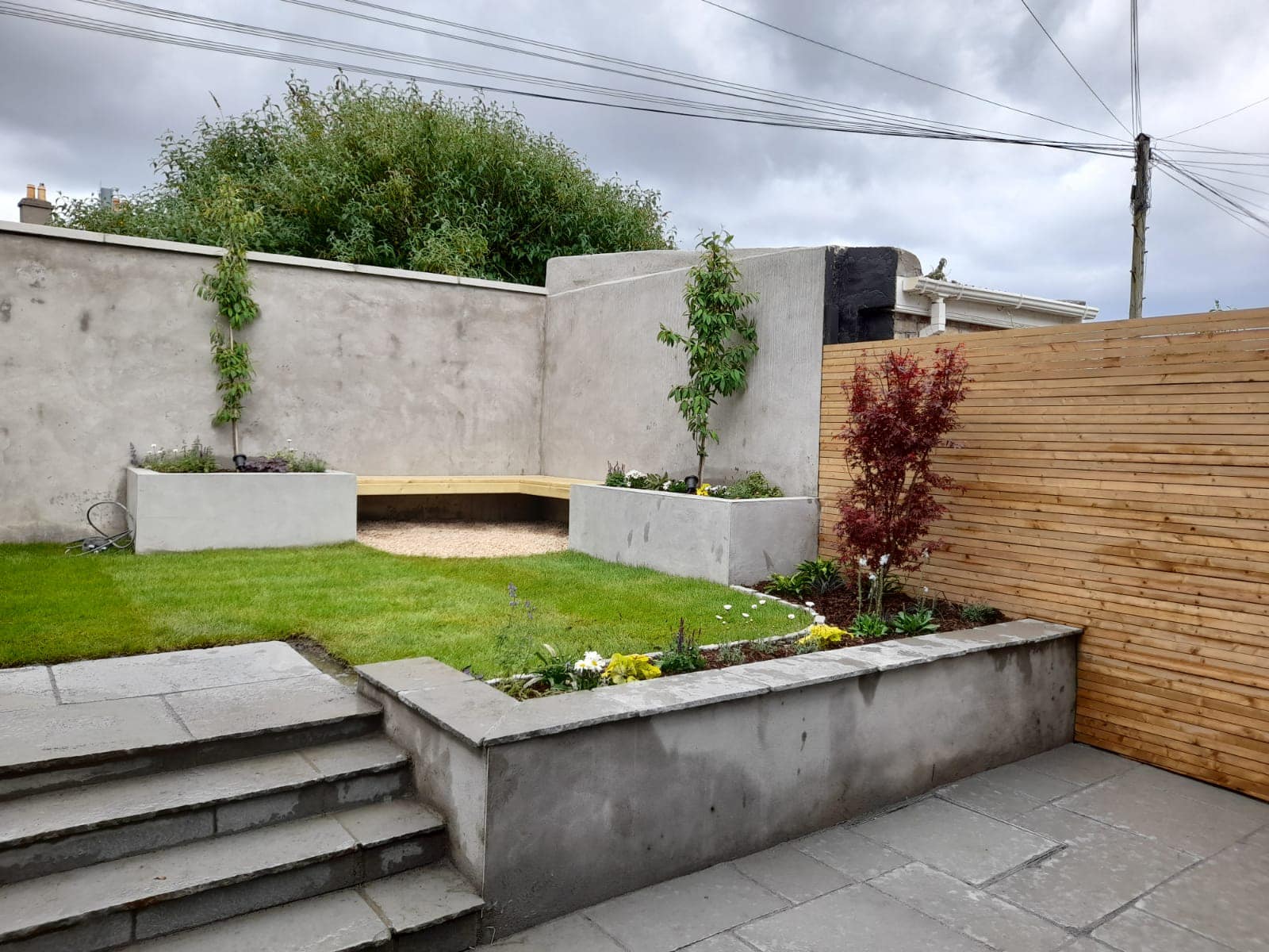 Small split level rear garden... - Pelicanlandscapes.ie | Facebook