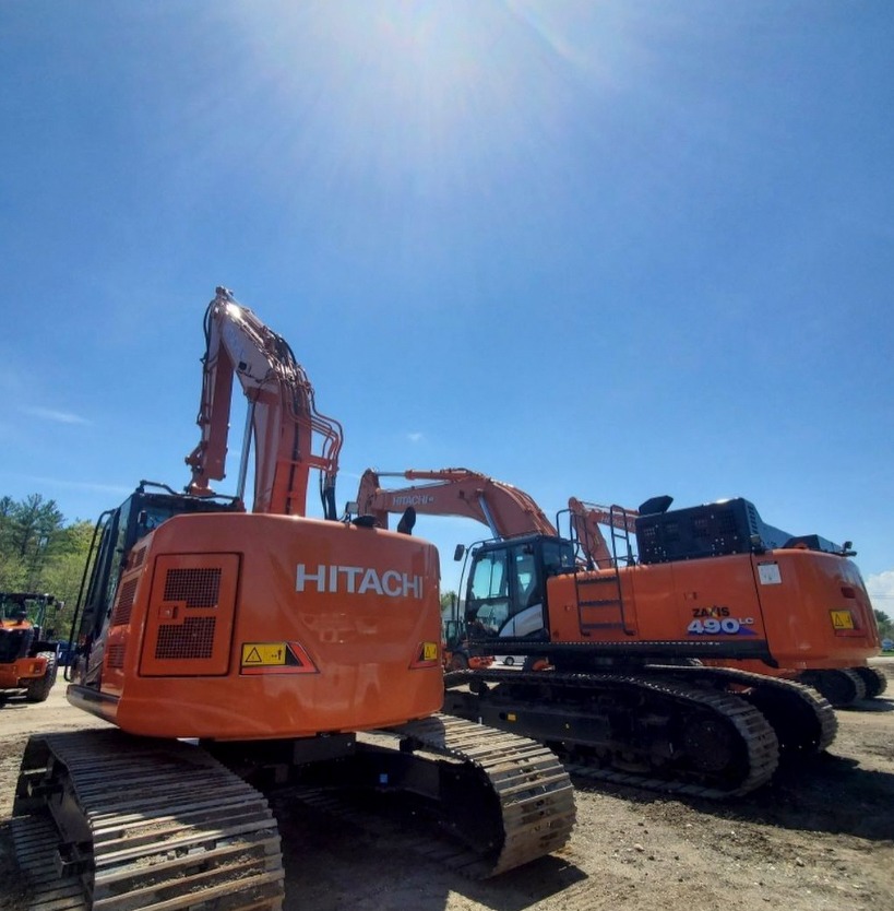 A Hitachi ZX490LC-6 accompanied by a fleet of machines in Concord