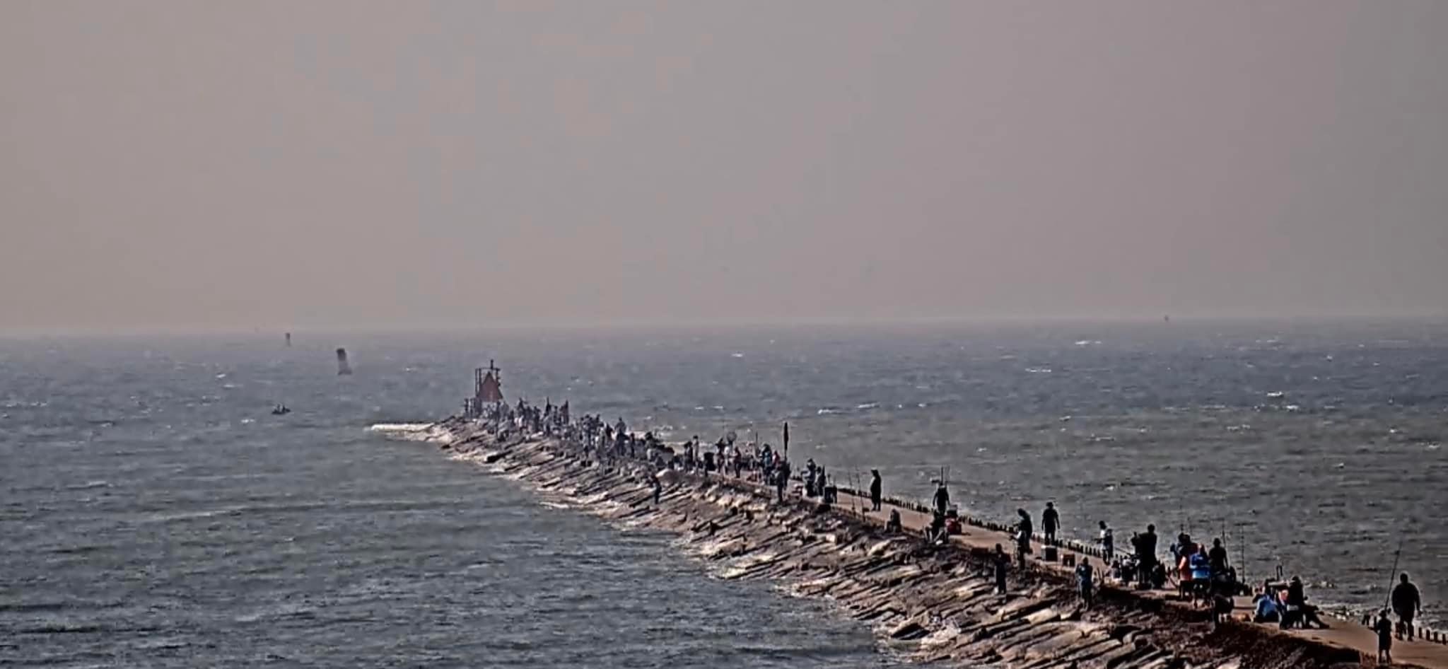 Muddy water at Surfside Jetty in Freeport, Texas