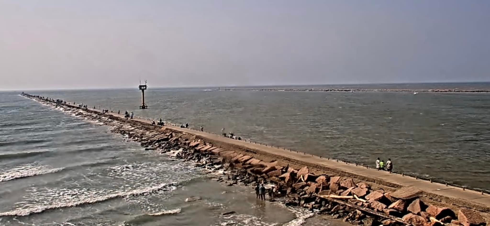 Muddy water at Surfside Jetty in Freeport, Texas