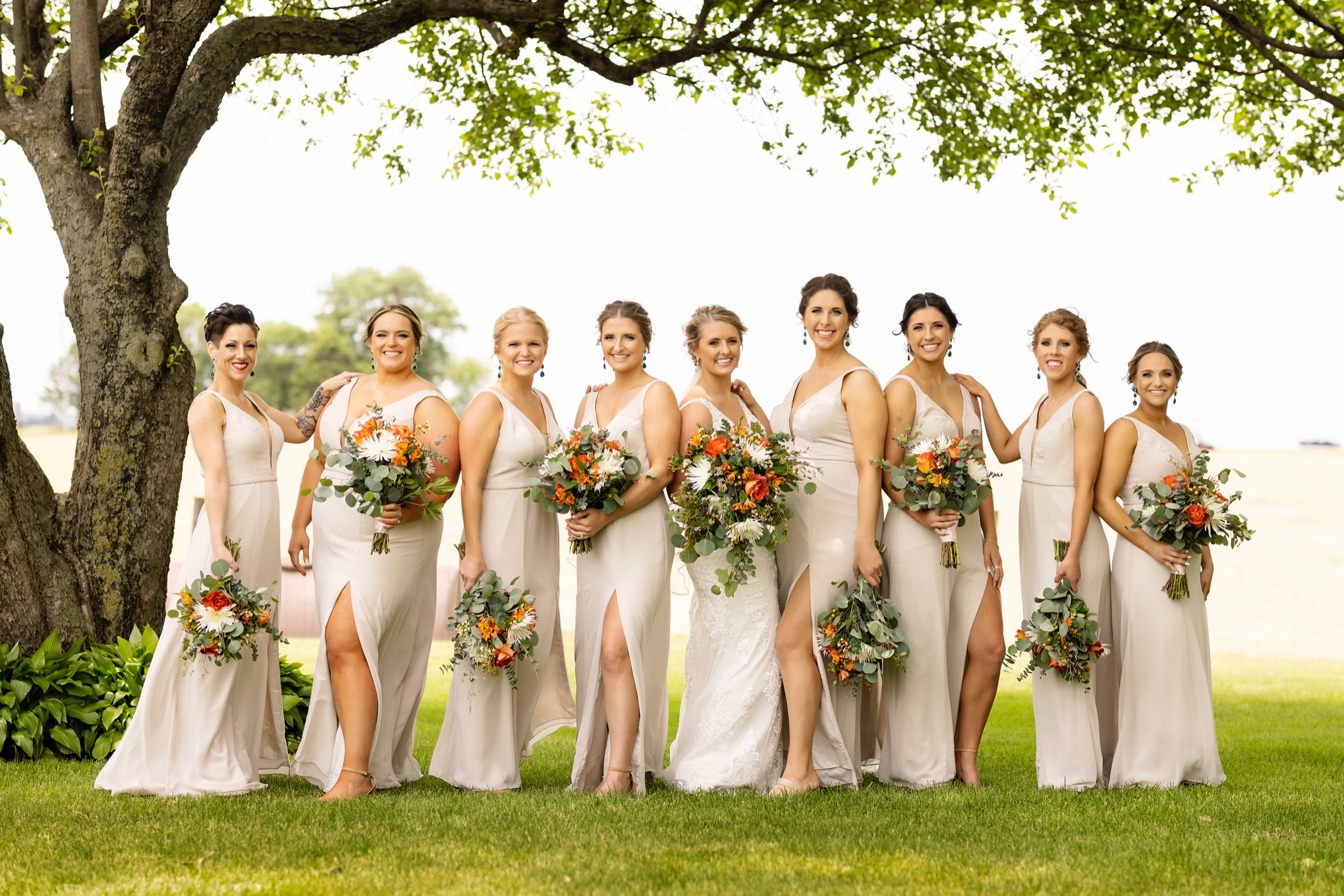 schaffers bridesmaid dresses Taylor and her bridesmaids are STUNNING! 🤍 www.ekpweddings.com | Kaely Venue: Zumbach Farms Couple: Taylor + Blake Second Photographer: Chase Wagoner Dresses: Schaffer's Color:#17-Ice Apricot while the ruched bodice feature: prespants-fabric Bridal Style - Boho