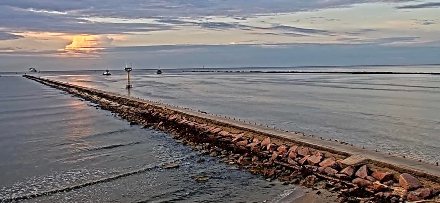 Muddy water at Surfside Jetty in Freeport, Texas