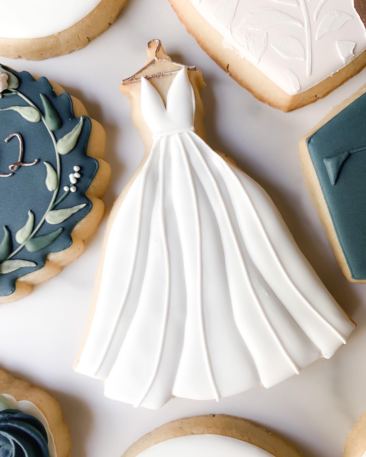 My favorite wedding dress cookie cutter from @charlson_cookieco . . . . . . . #cookies #decoratedcookies #royalicingcookies #royalicingart #royalicing #customcookies #cookiesofinstagram #cookieart #decoratedcookies #talentedcookiers #bridalshower 