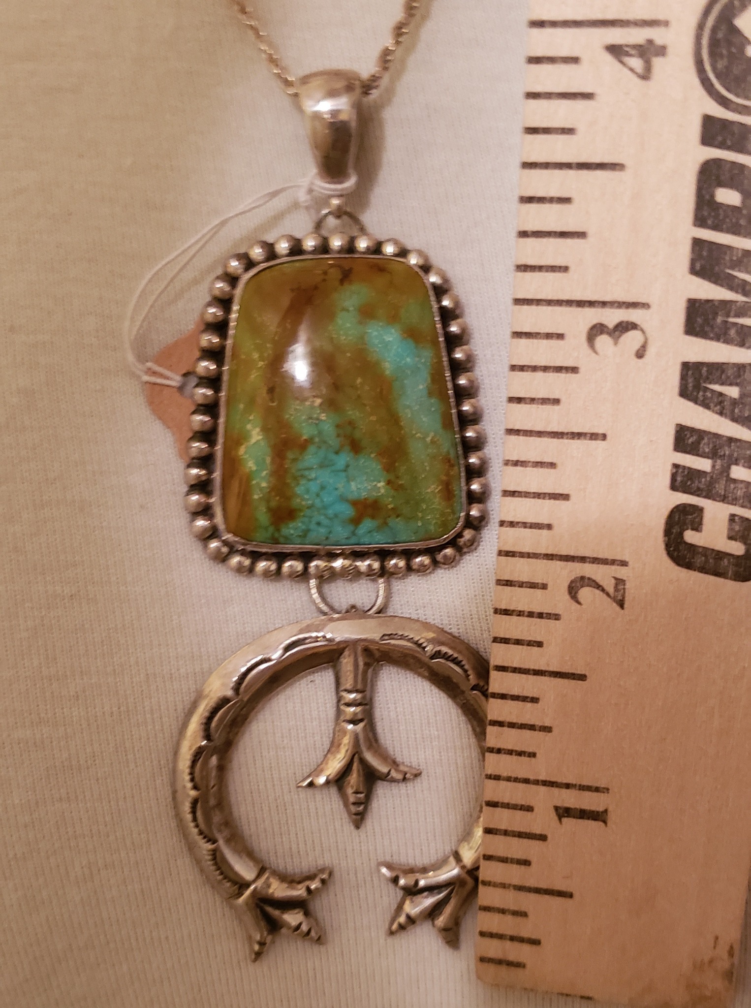 What does Navajo stamp on necklace mean?