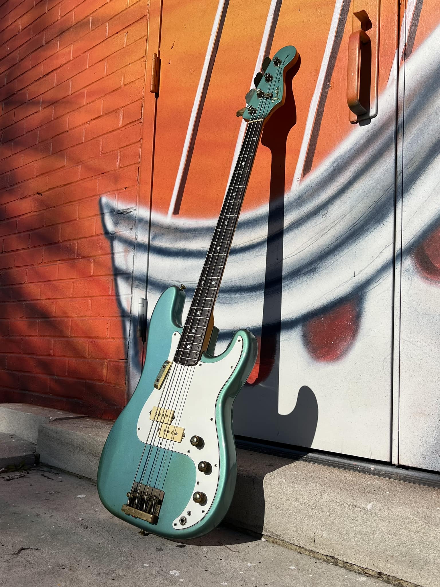 A 1981 Fender Precision in Aztec gold metallic finish, a custom
