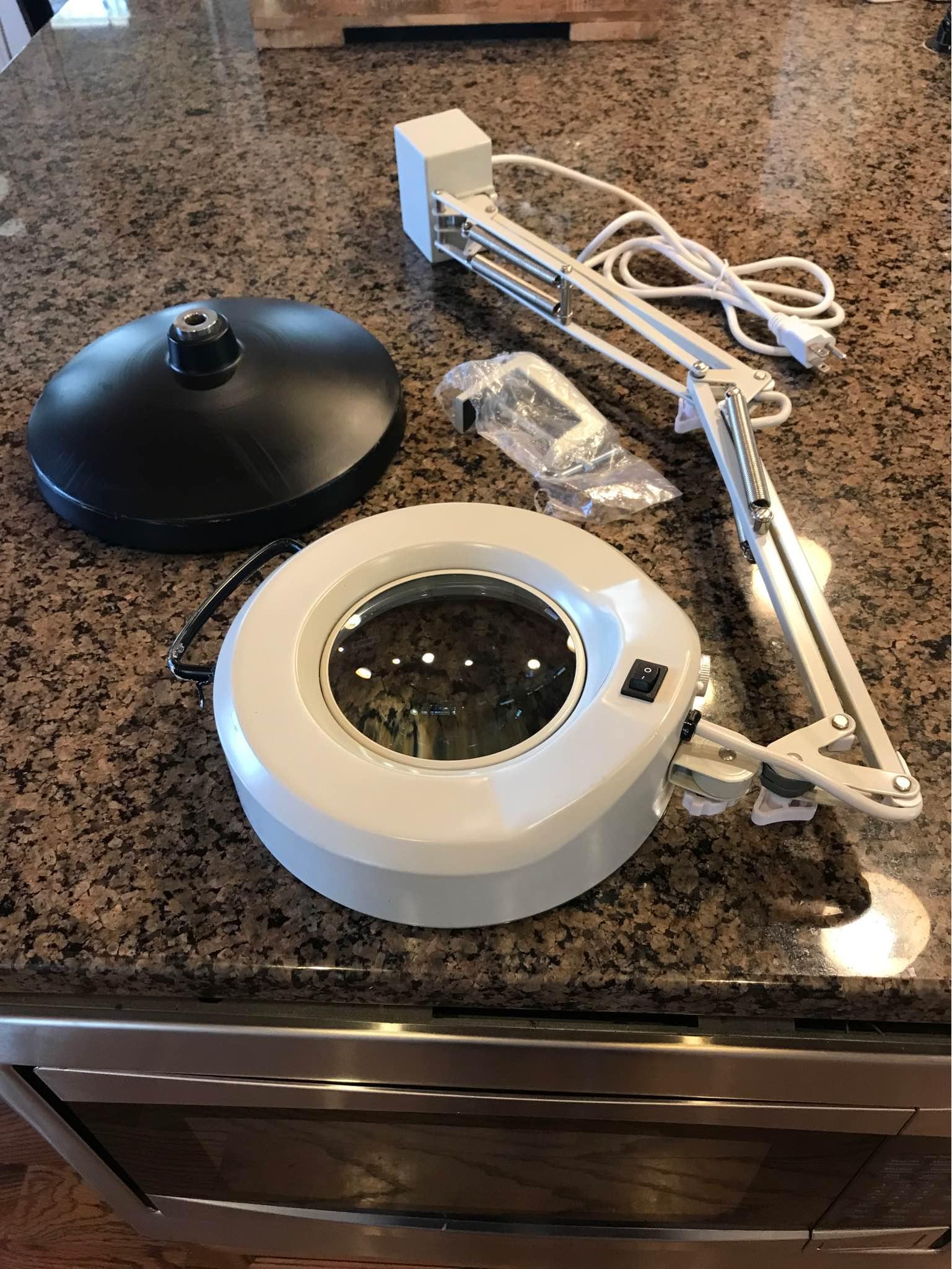 What brand is this vintage magnifying glass with a light?