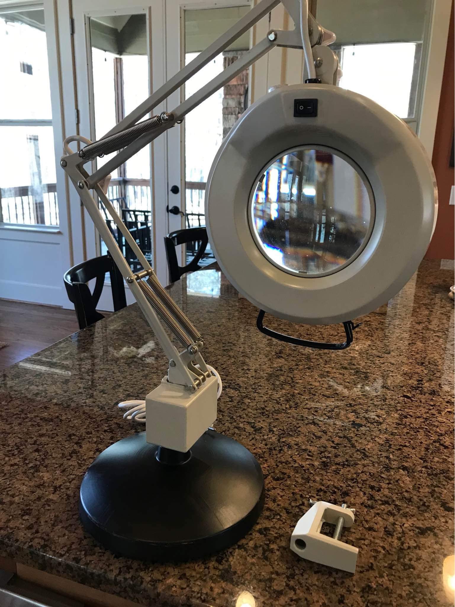 What brand is this vintage magnifying glass with a light?