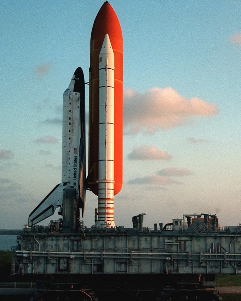 Astronomy - A rare sight: a shuttle rolling back from the pad. 🚀 Bathed ...