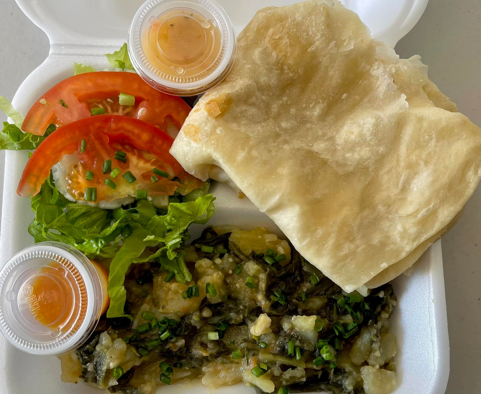 Vero’s Kitchen - Special order 🎉 Spinach w/ potato and roti 👌🏾