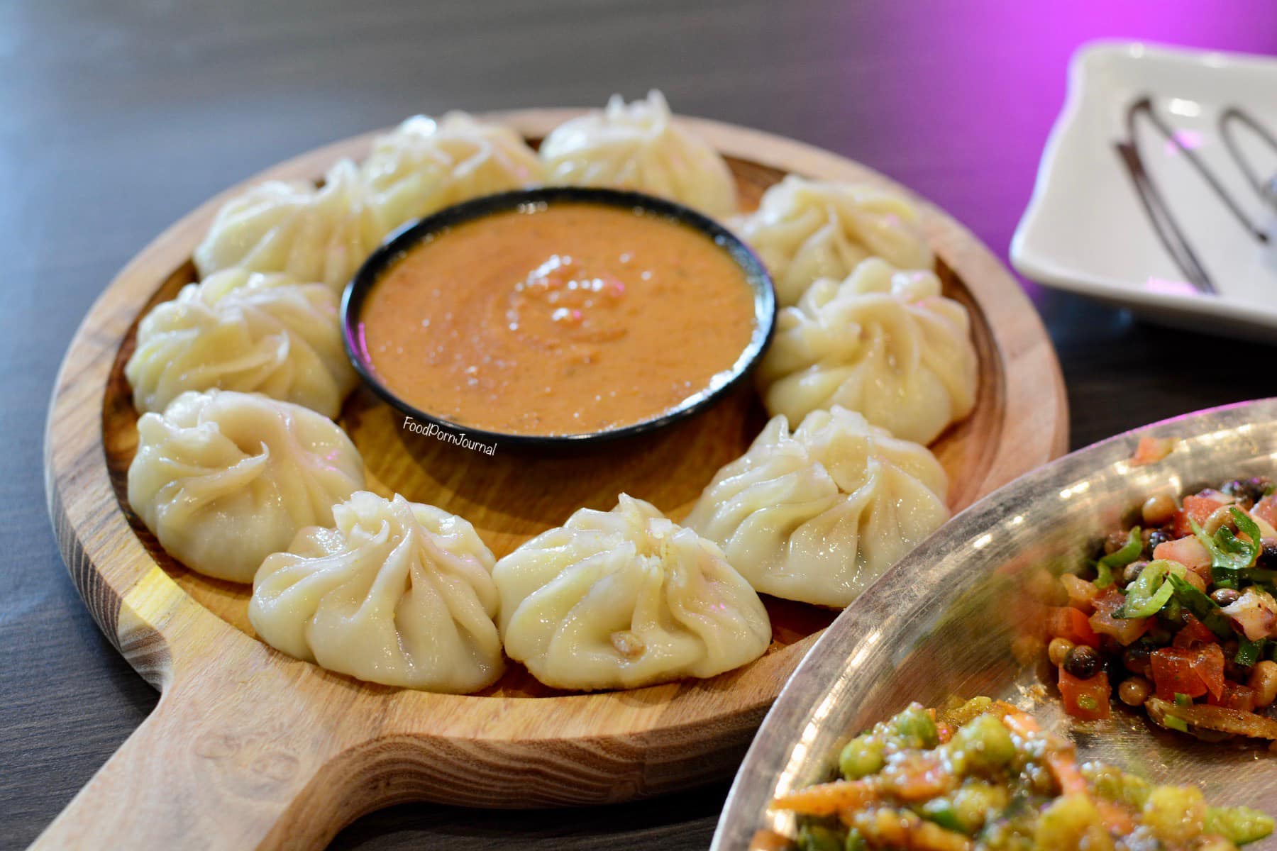 Chicken momos and house spiced tea in Cincinnati
