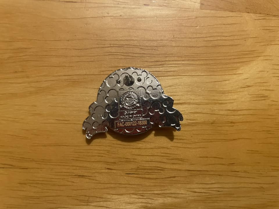 I've never seen an orange serial # on a pin. Does that mean it's fake?