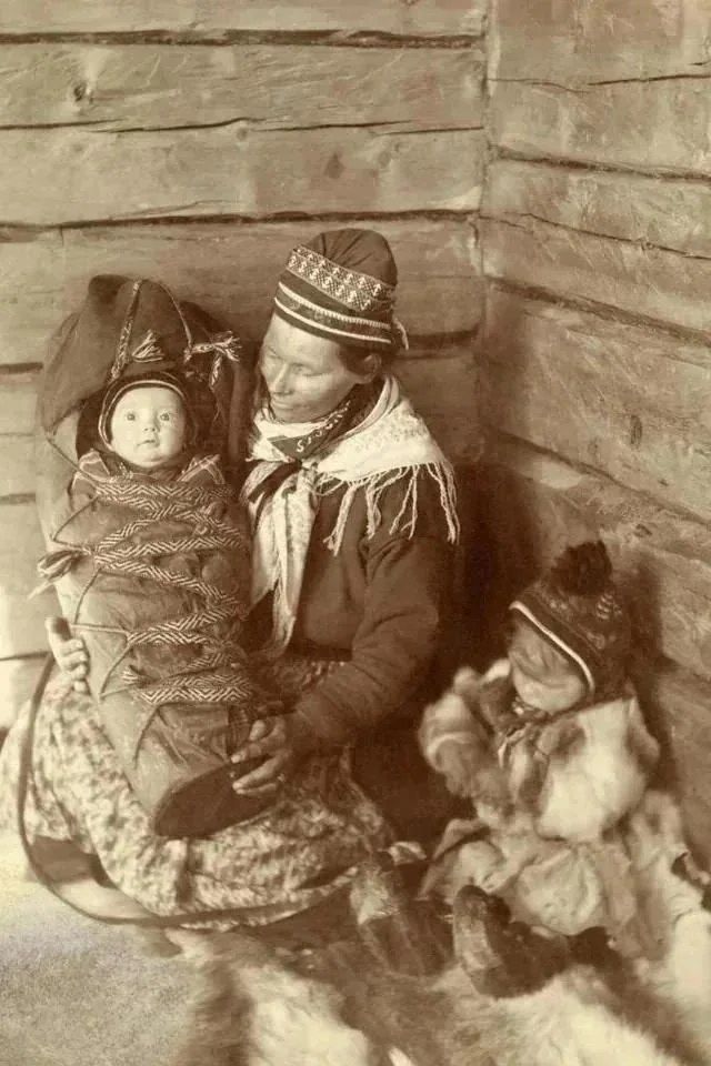 History Defined - A Sami woman, toddler, and infant in...