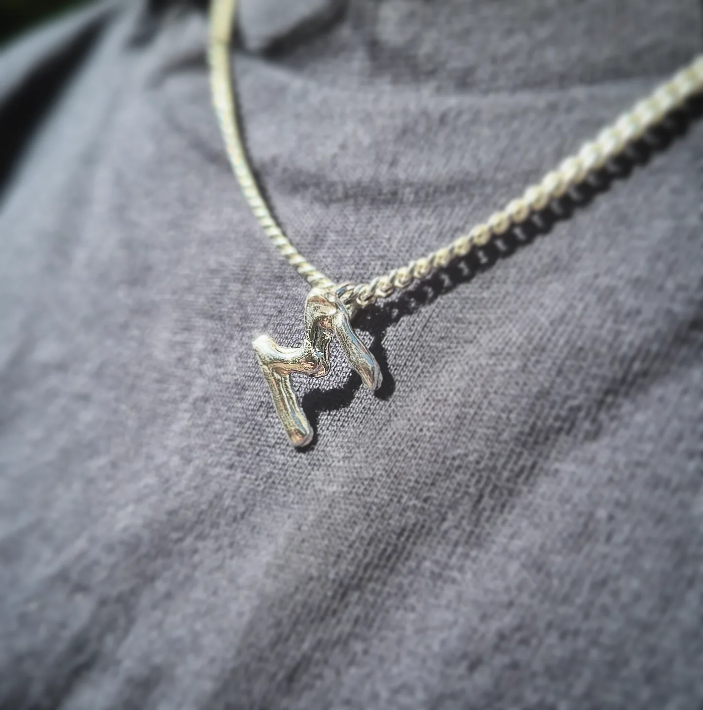 Claudia sent her M letter necklace to our studio to add the letter 