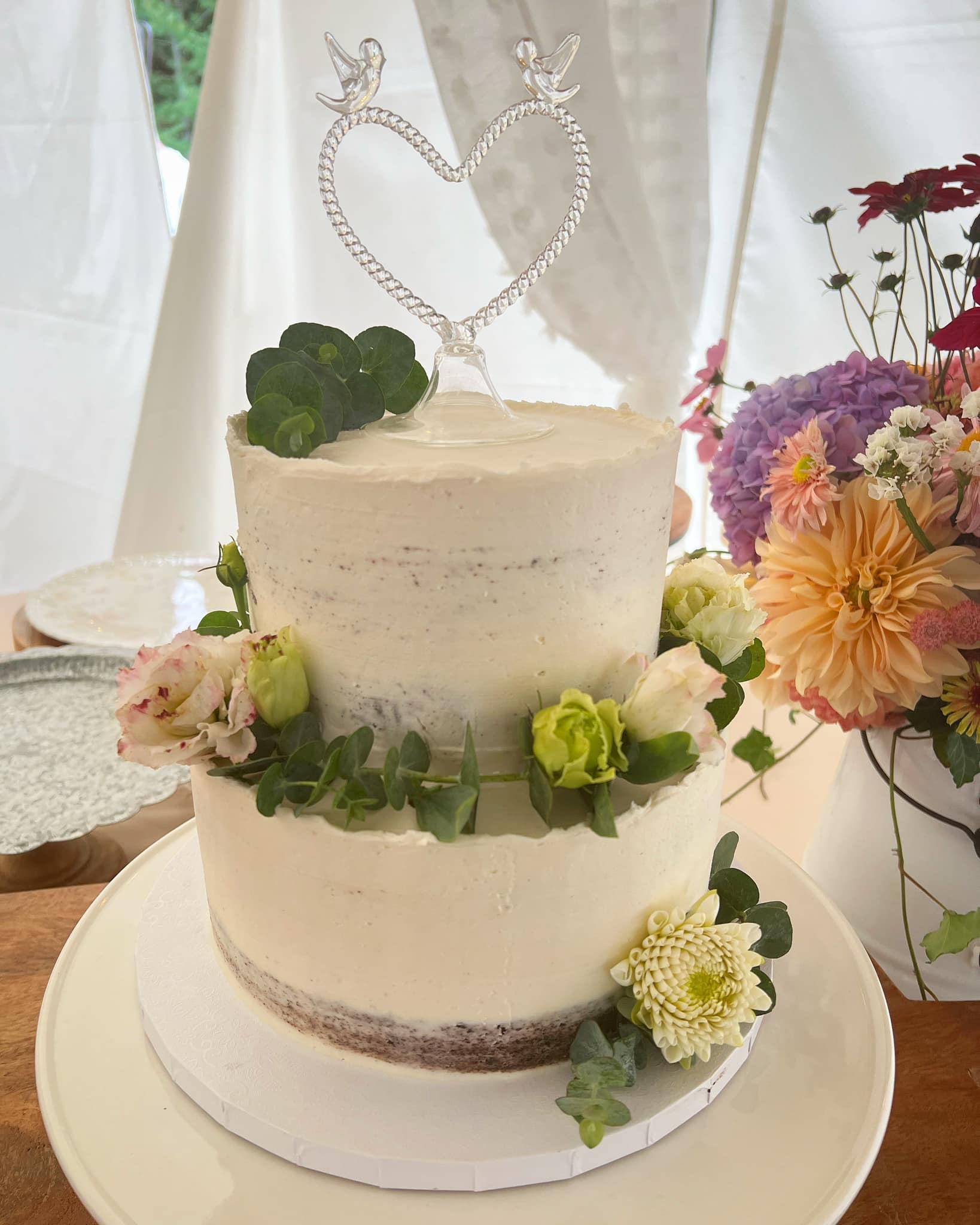 Two-tier vegan wedding cake with buttercream flowers