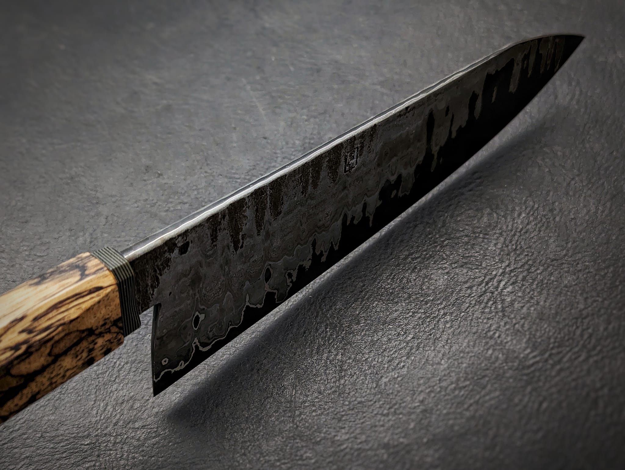 San mai chef knife with 1095 core and spalted tamarind handle