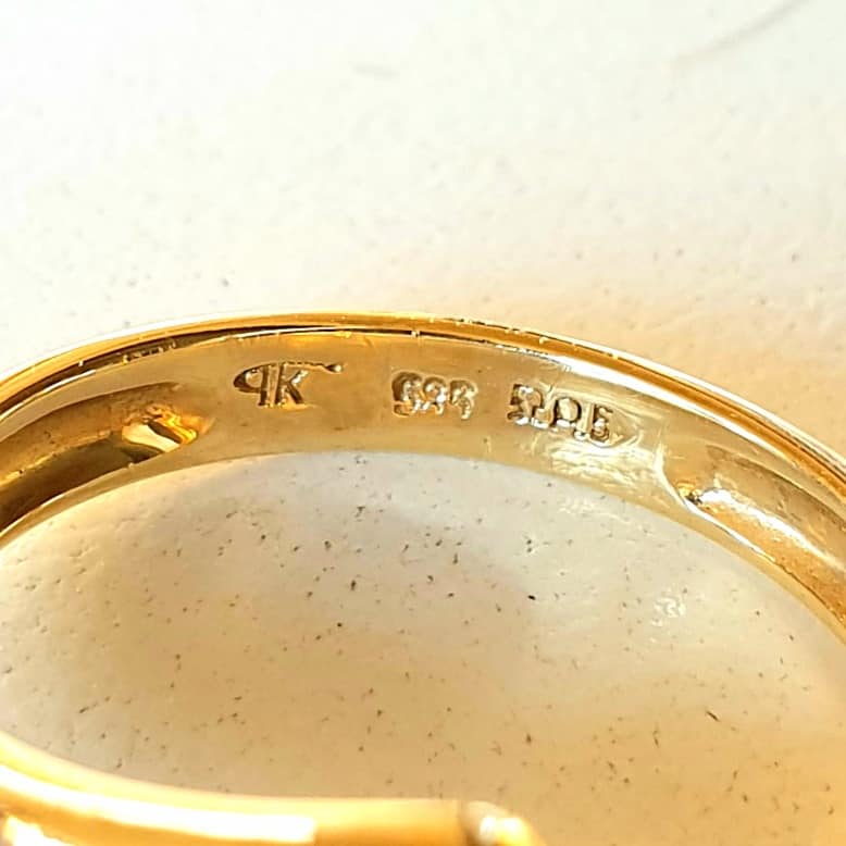 What is the meaning of the 585 stamp on 14k gold jewelry?