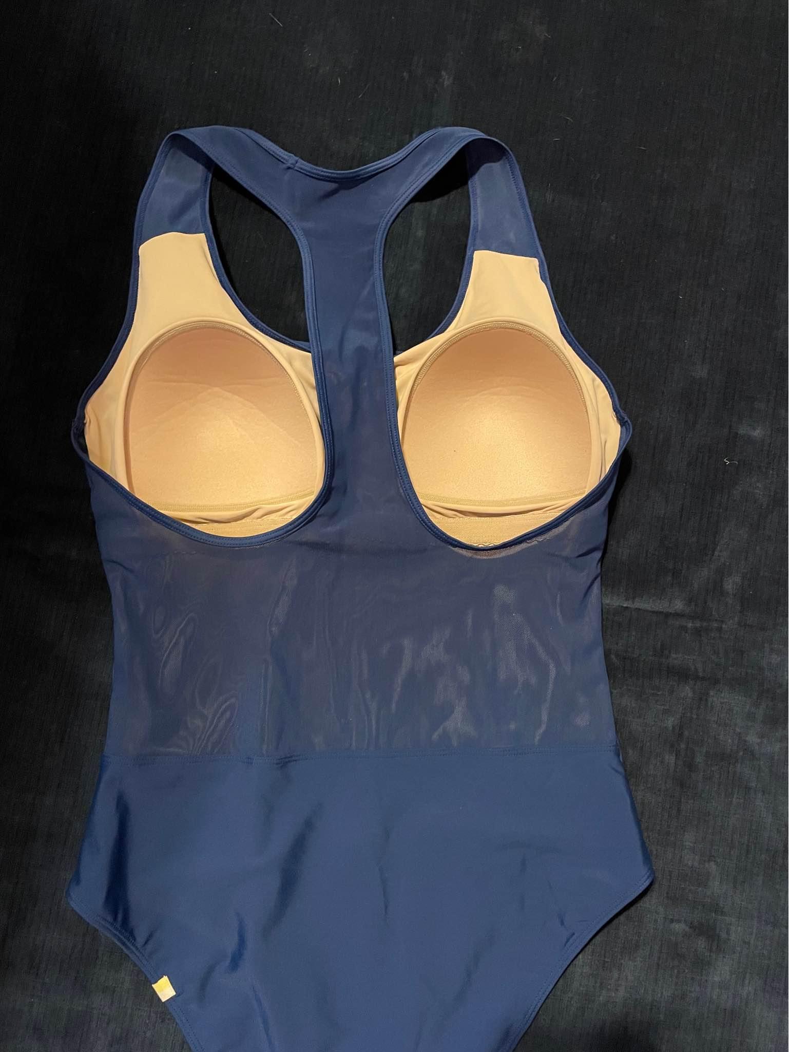 Swimming suit size medium back is translucent starchy fabric blue ...