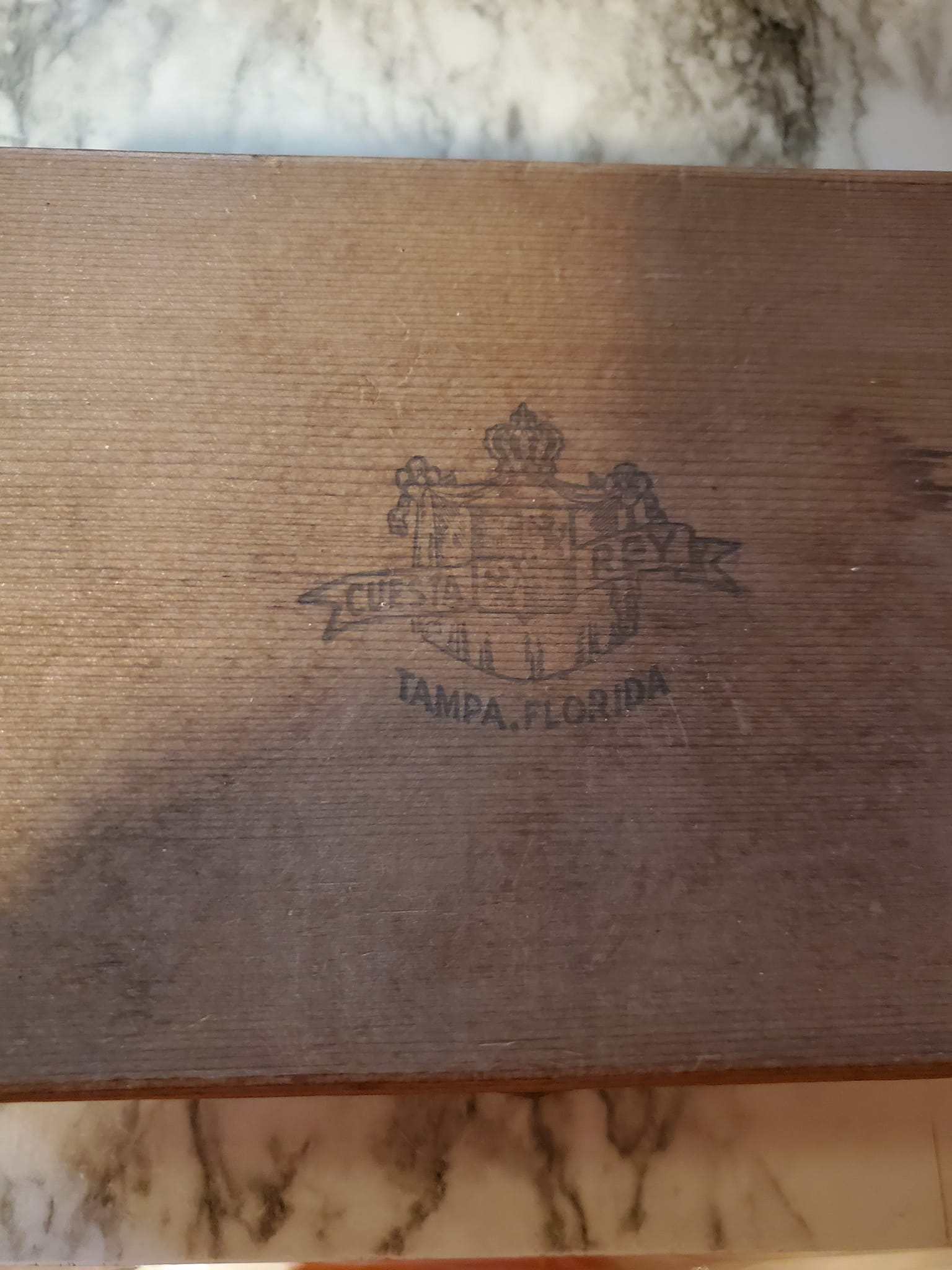 Vintage wooden cigar box is brown with a hinged lid and metal