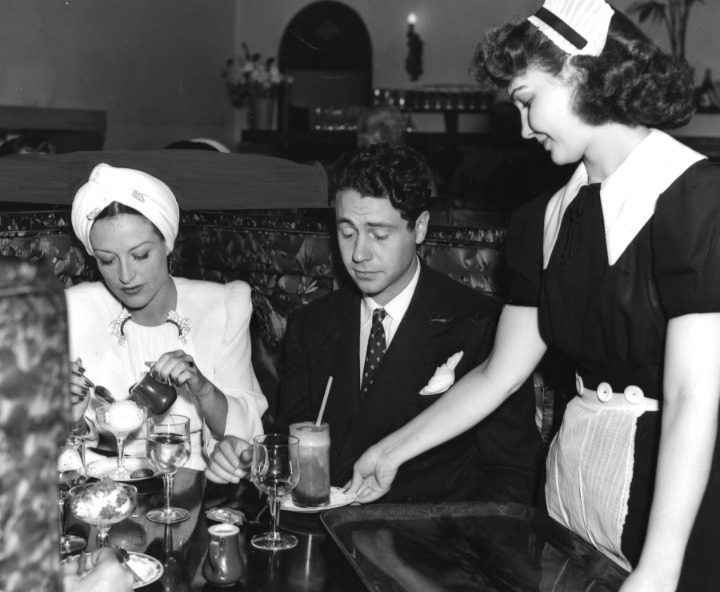 Joan Crawford enjoys hot chocolate fudge sundae at CC Brown's