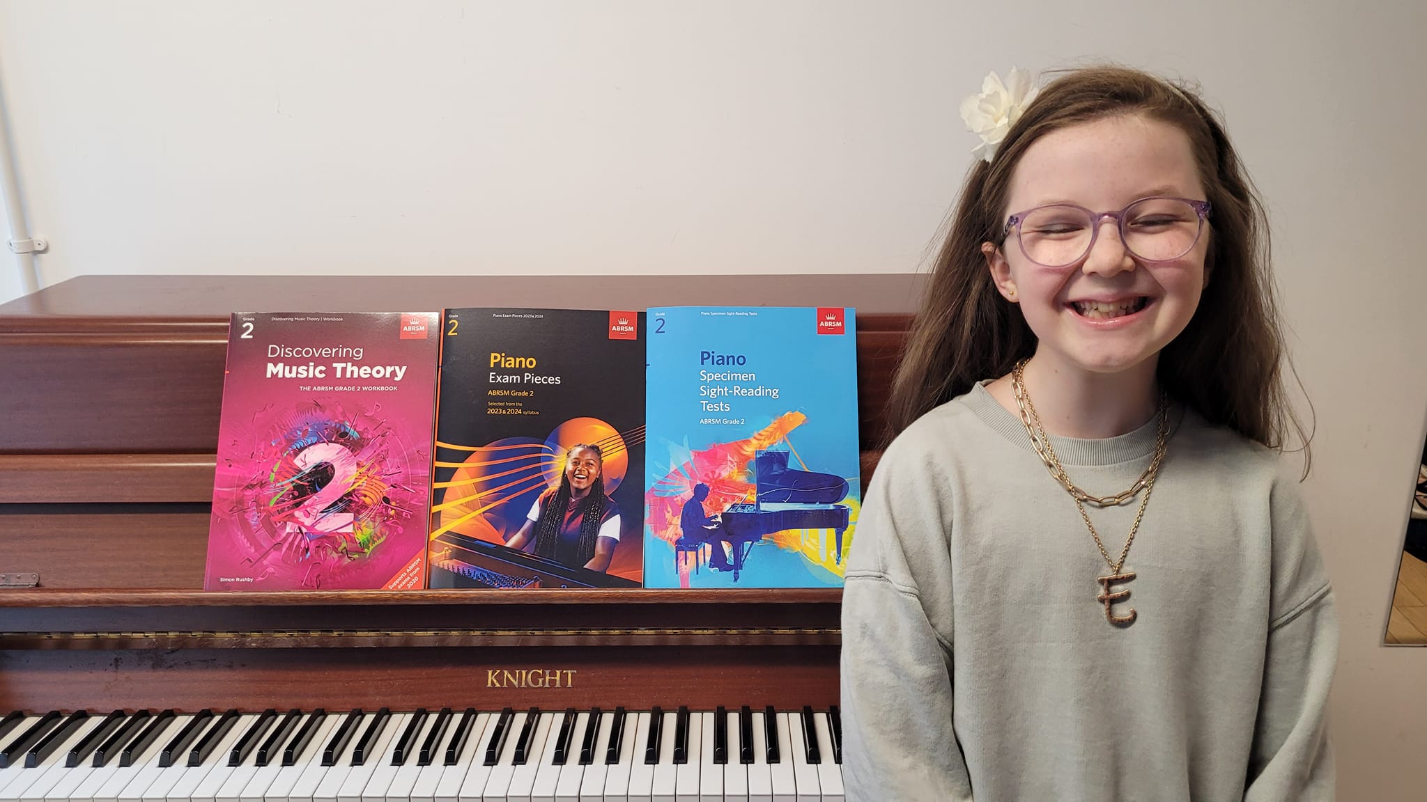 Happy pupil moving from grade 1... - Piano Lessons in Torbay