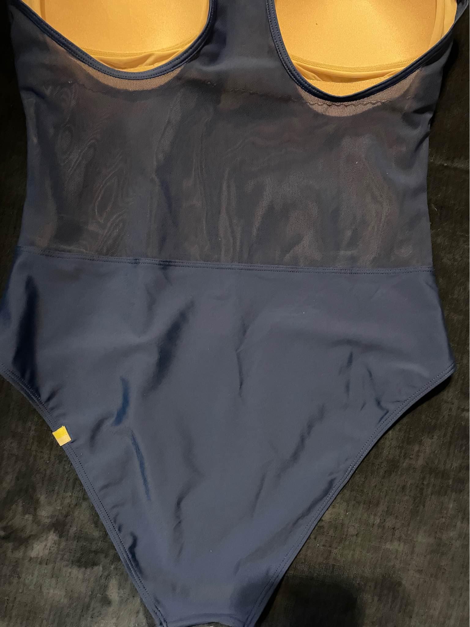 Swimming suit size medium back is translucent starchy fabric blue ...