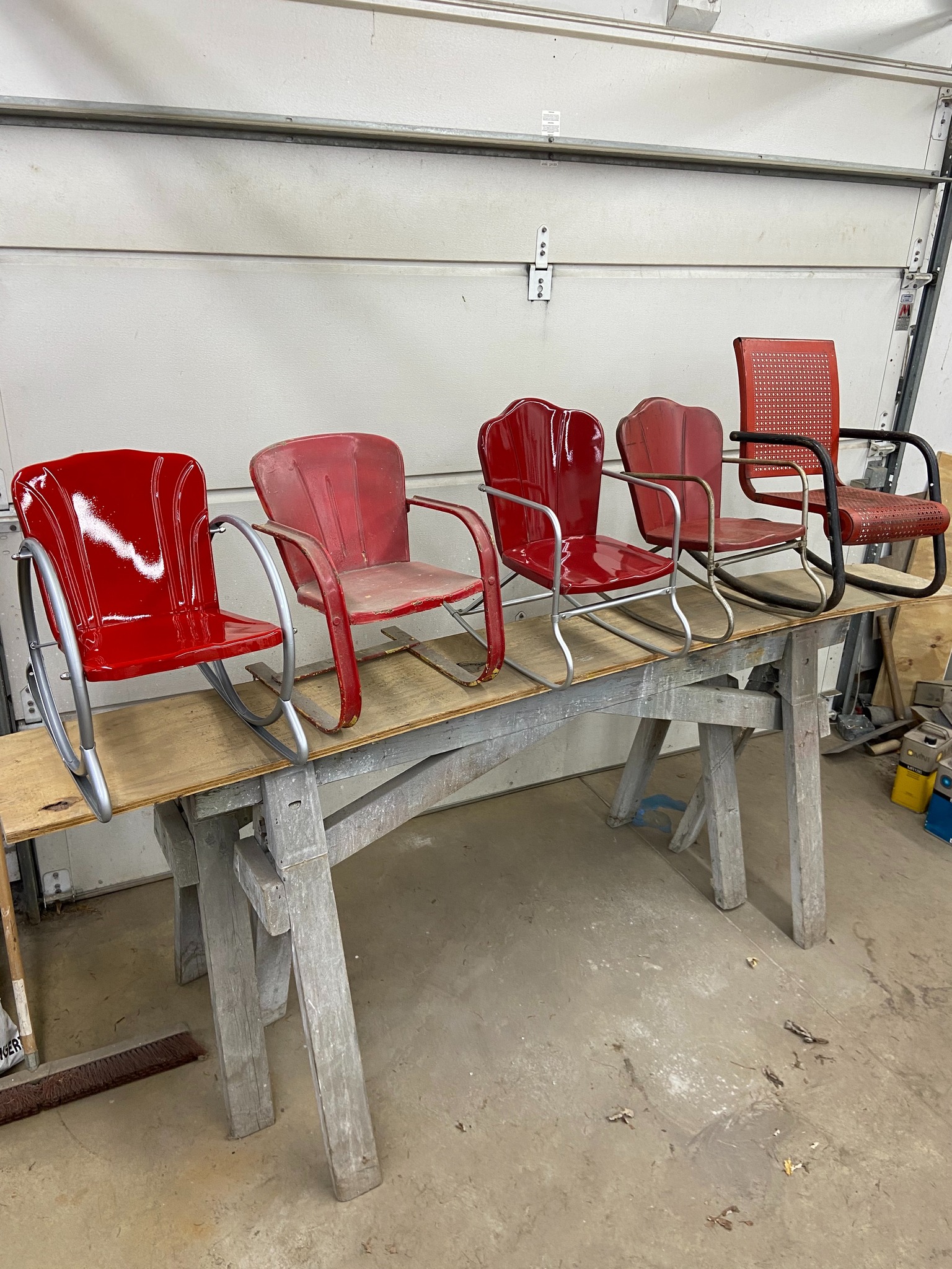 Restored Chevy truck red ring-o-rock chair with Volvo semi silver 