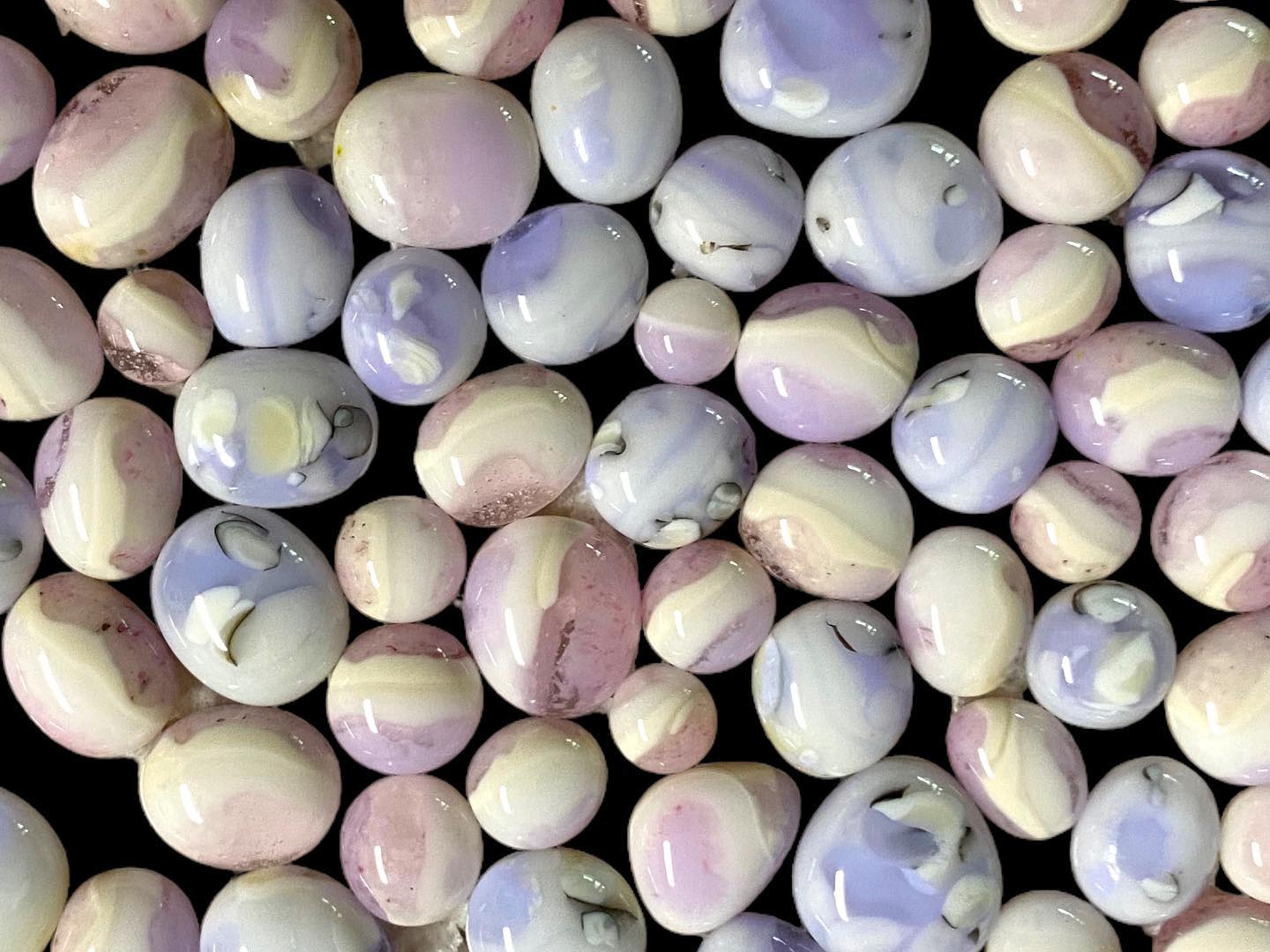 What glass has pink, blue, green, and purple colors?