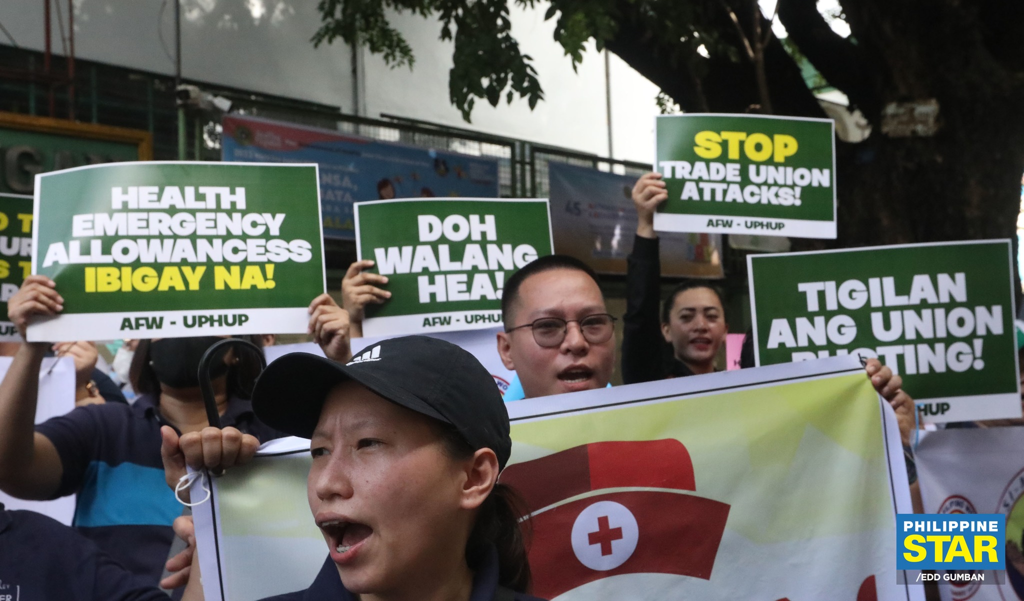 Philippine - Healthcare workers stage a protest rally in front of the ...