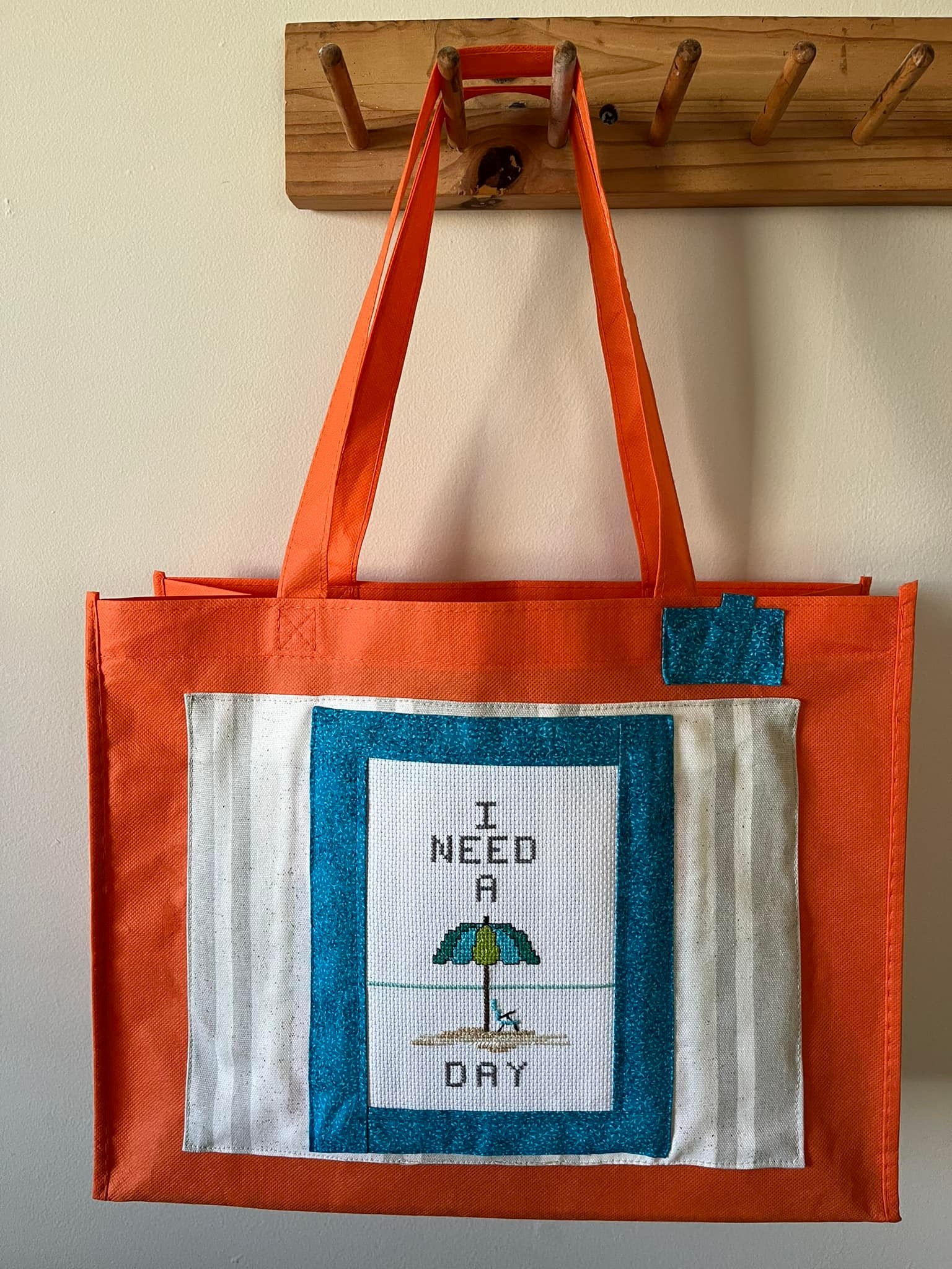 Upcycling branded tote bags with embroidery and ironing techniques