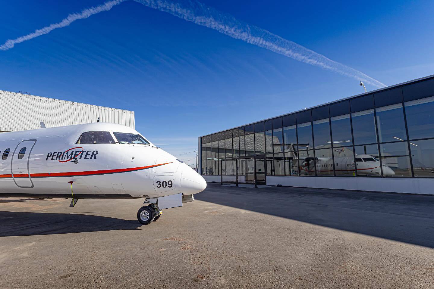 That - A DASH 8 REFLECTS….. A Perimeter Dash 8-300 sits in front of the ...