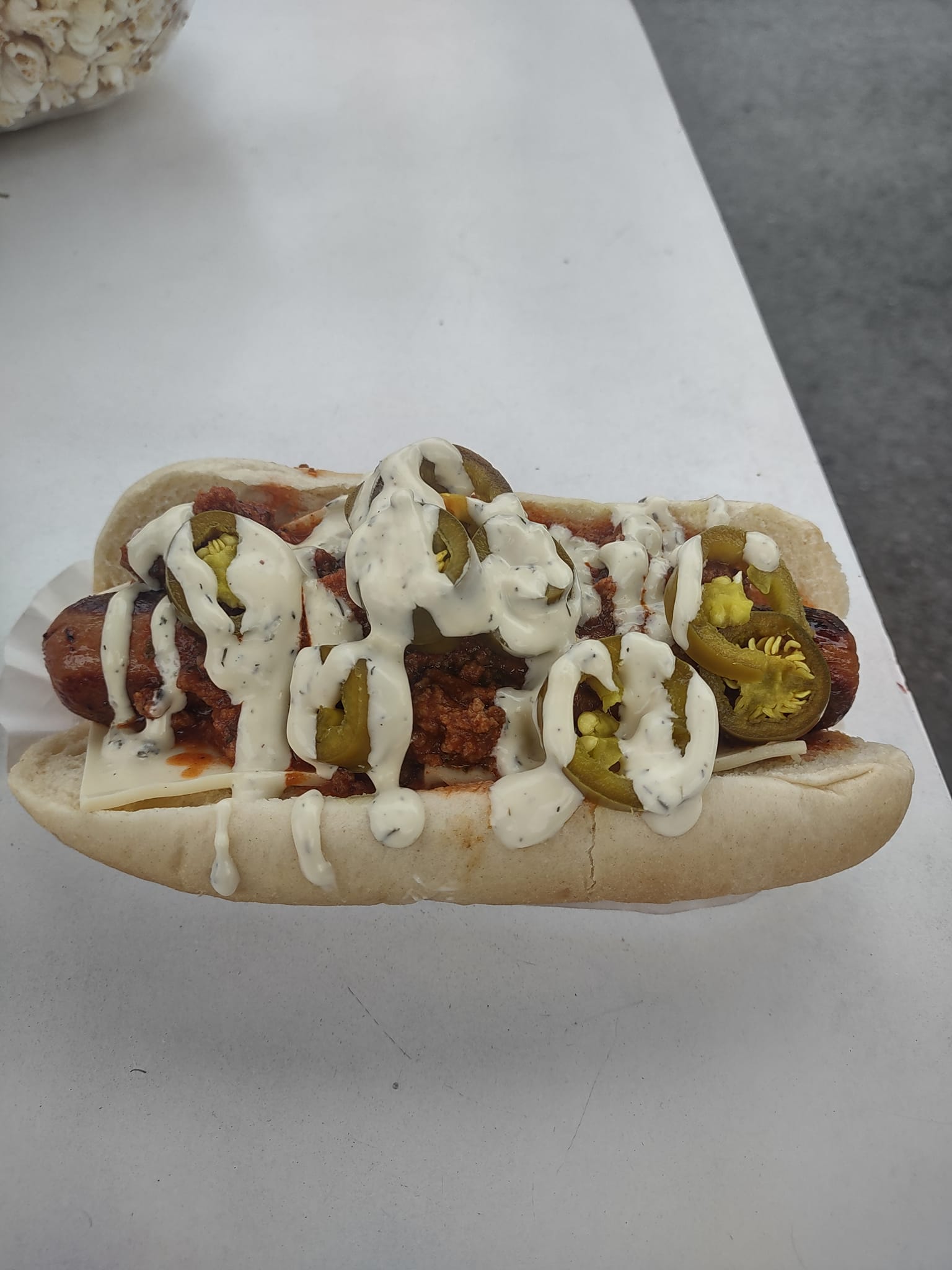 Hepple dog at Alamo with chili, cheese, and jalapeno