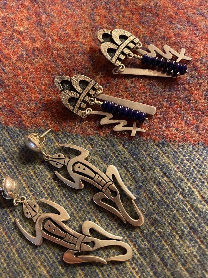 Hopi artist Roy Talahaftewa's silver earrings and gold ring