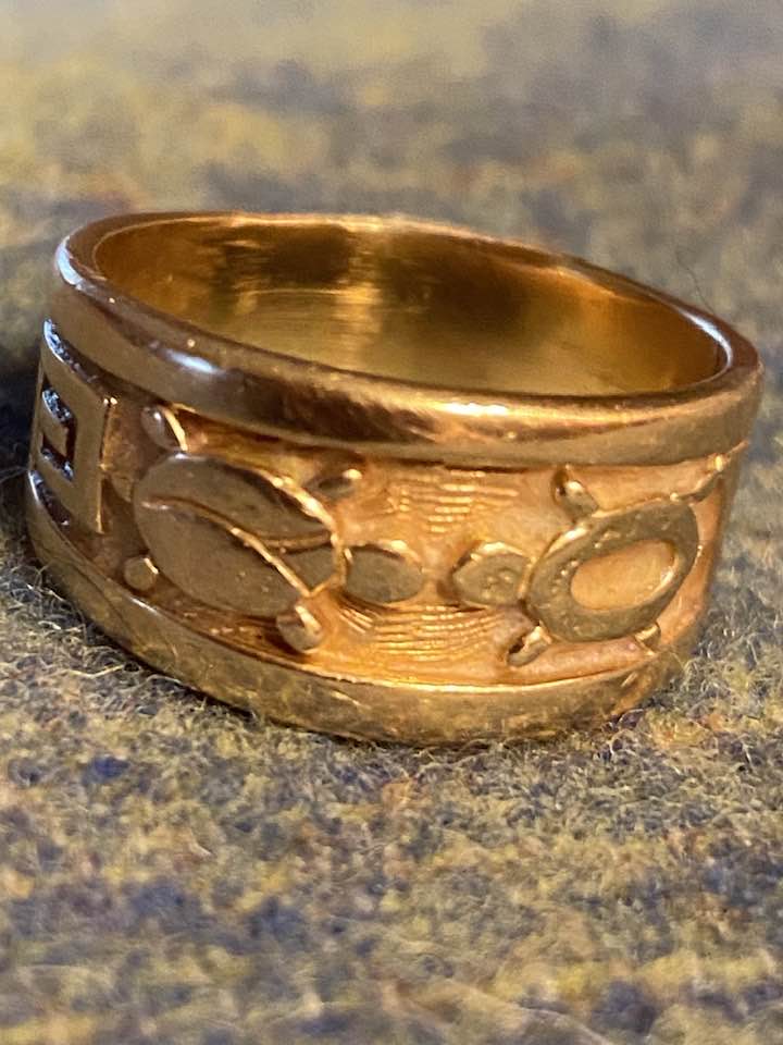 Hopi artist Roy Talahaftewa's silver earrings and gold ring