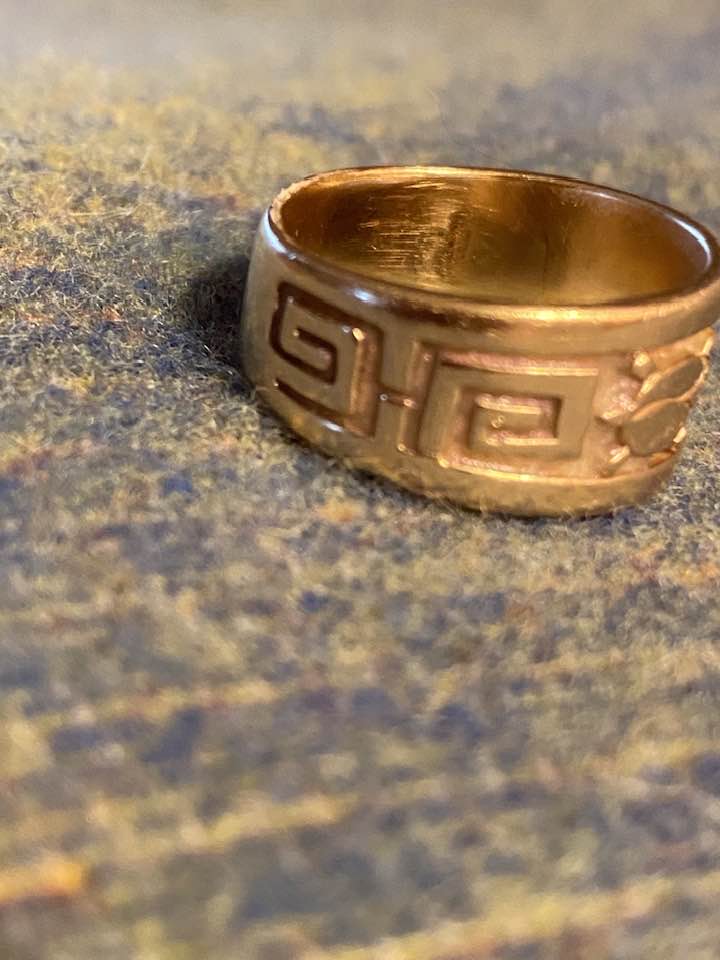 Hopi artist Roy Talahaftewa's silver earrings and gold ring