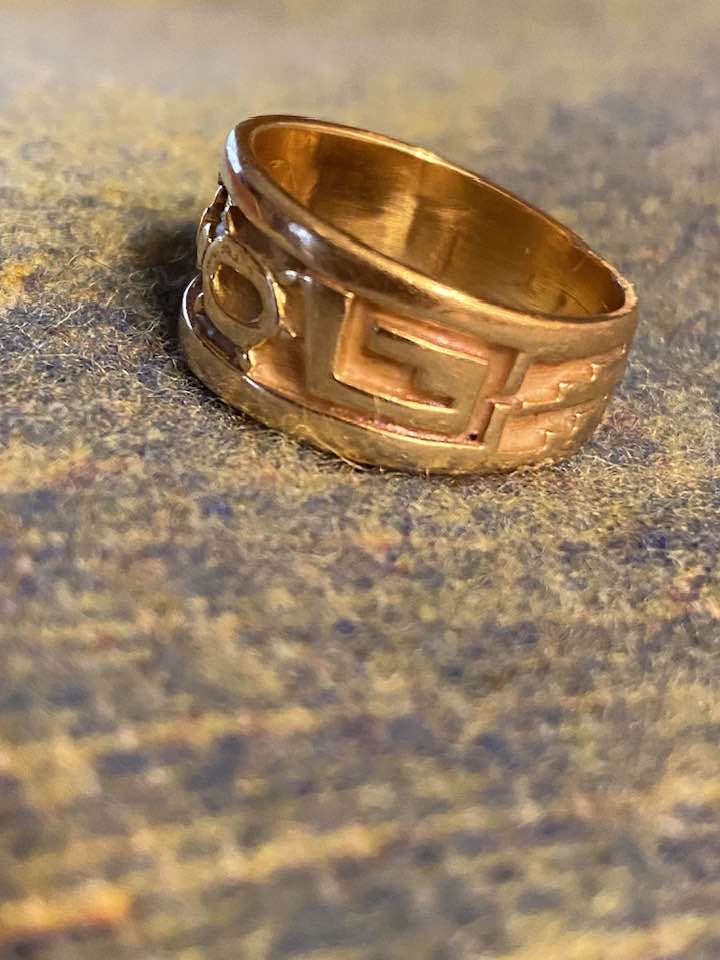 Hopi artist Roy Talahaftewa's silver earrings and gold ring