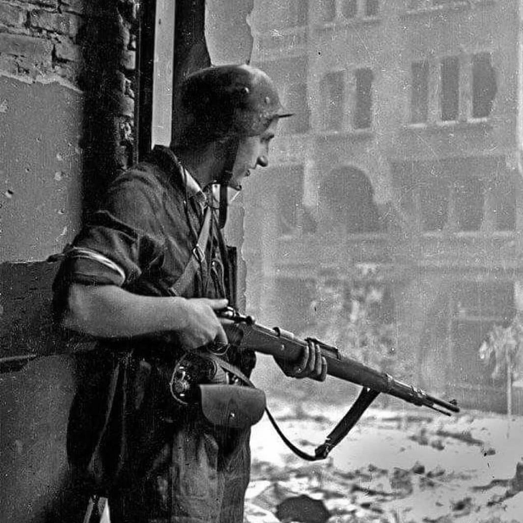 Vito - A teenage Polish Resistance fighter with a Kar98k rifle watches ...