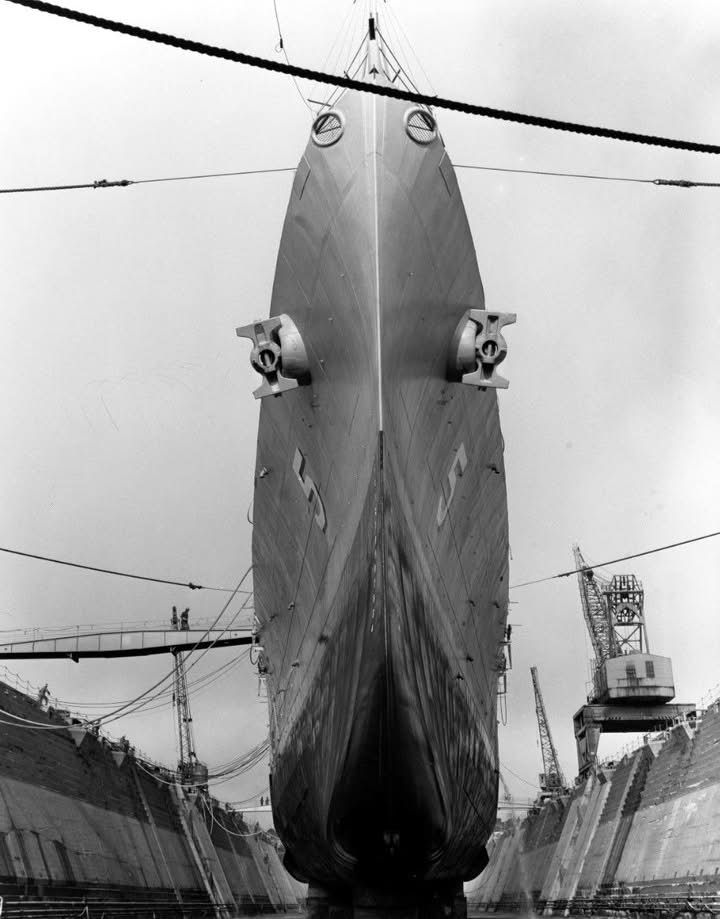 A look back to USS Oklahoma City CLG-5 making a tight turn to port