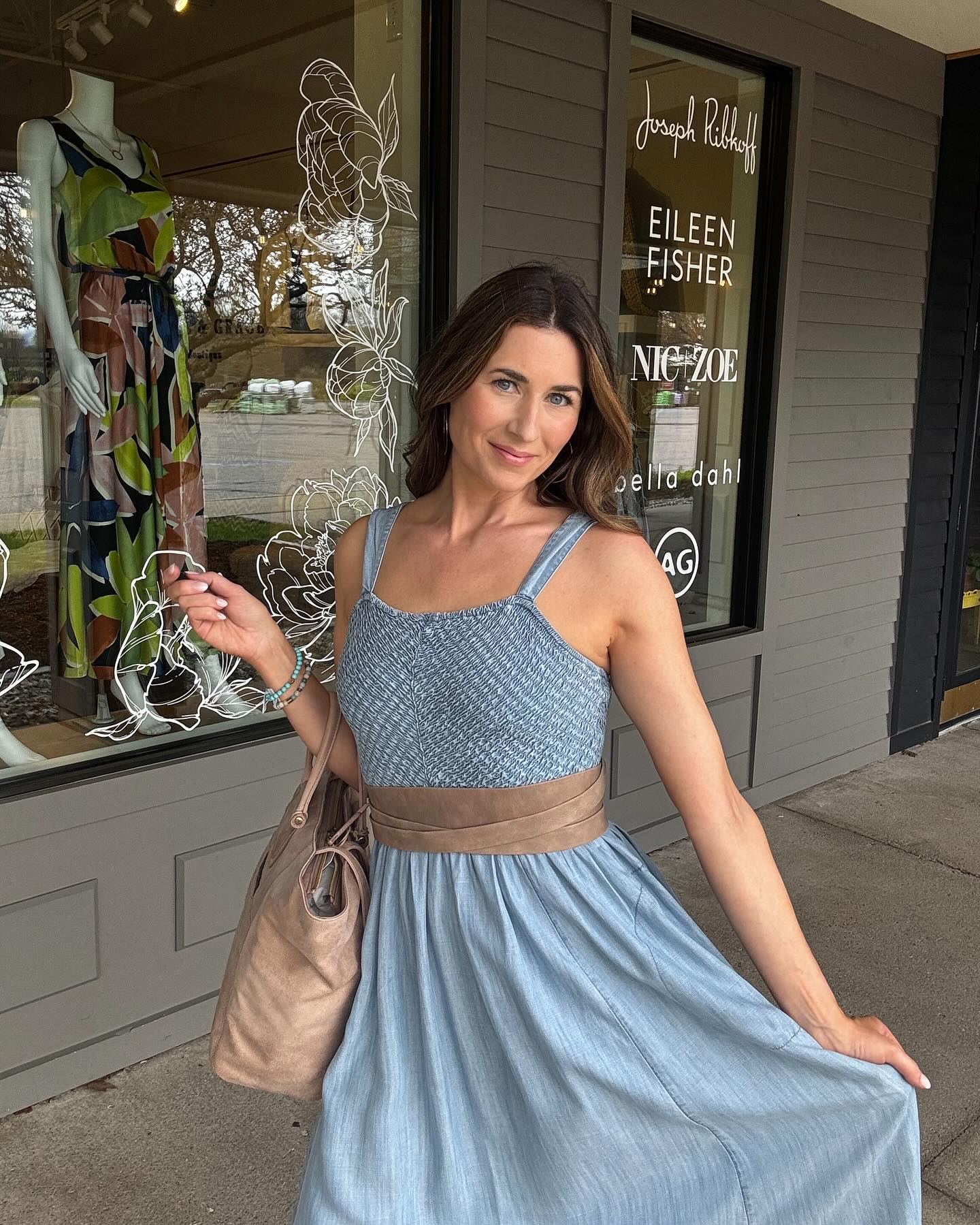 This is the dress you'll reach for all summer. The Sarah Denim Dress by @nicandzoe is lightweight, flattering, and versatile — with a smocked bodice, soft chambray flow, and just the right